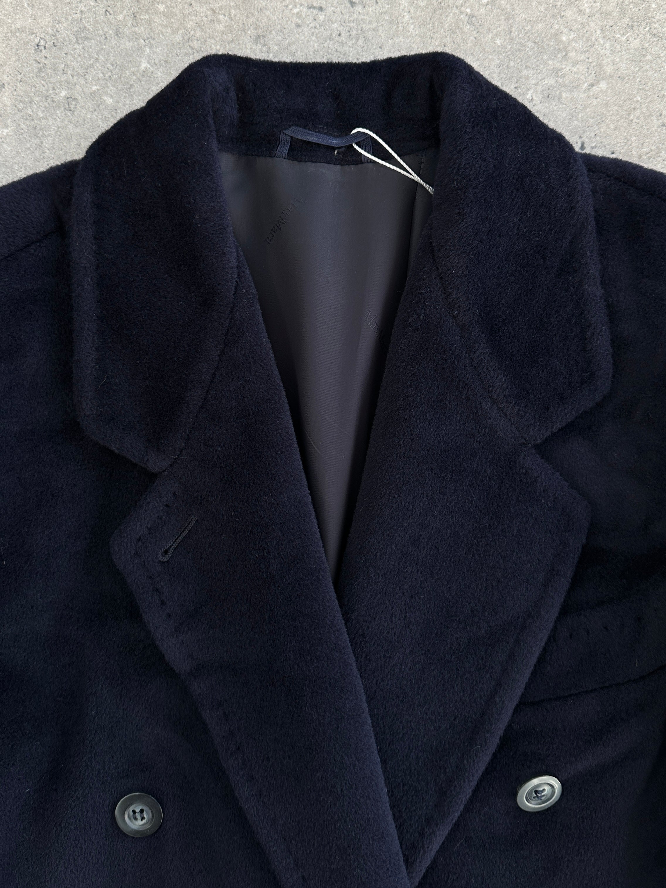 Max Mara pure wool double-breasted coat in size M, shown on a hanger with classic lapels and tailored fit.