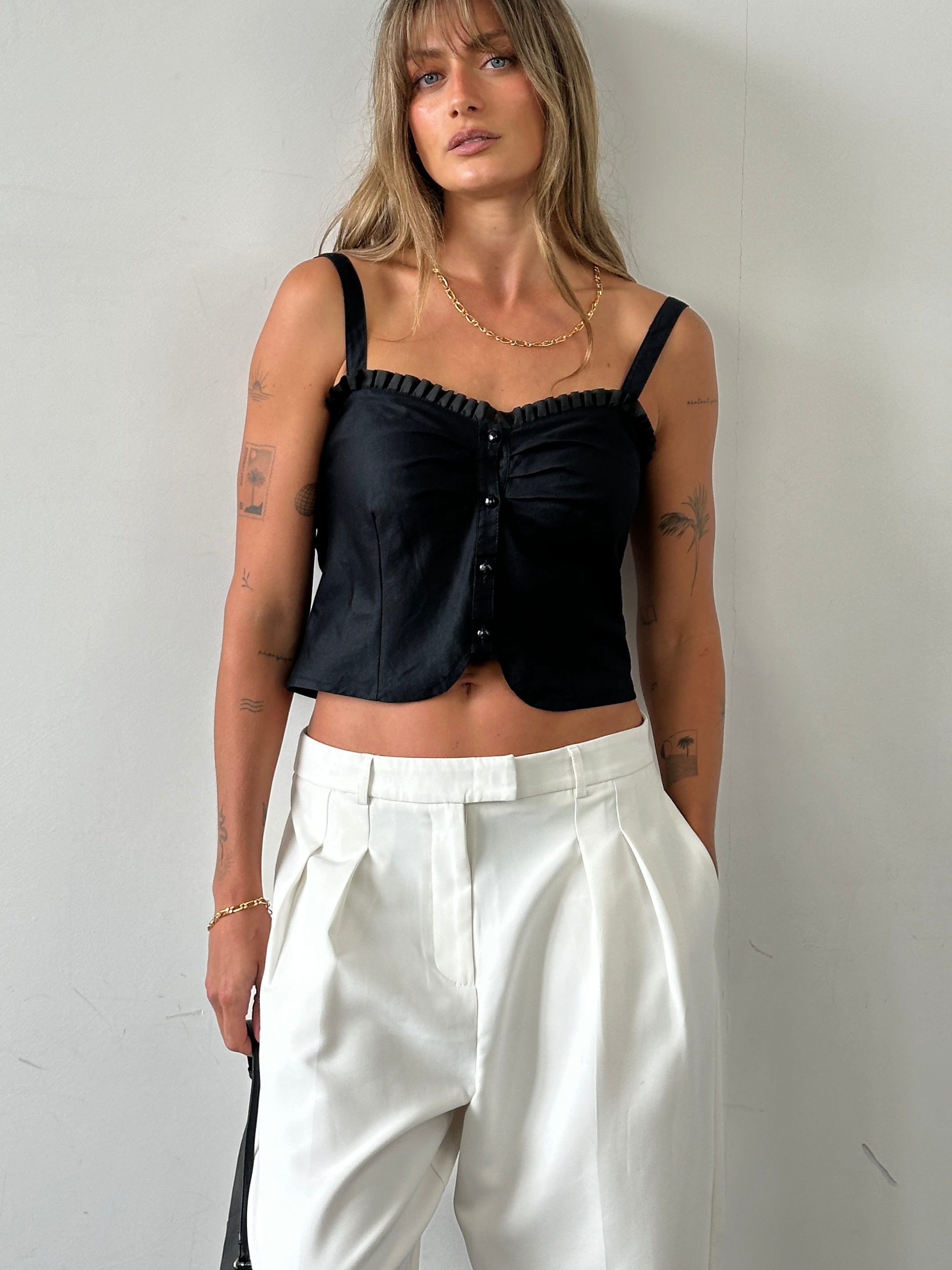 Vintage brand vintage frill trim crop top, size small, shown with ruffled neckline and floral pattern on lightweight fabric.