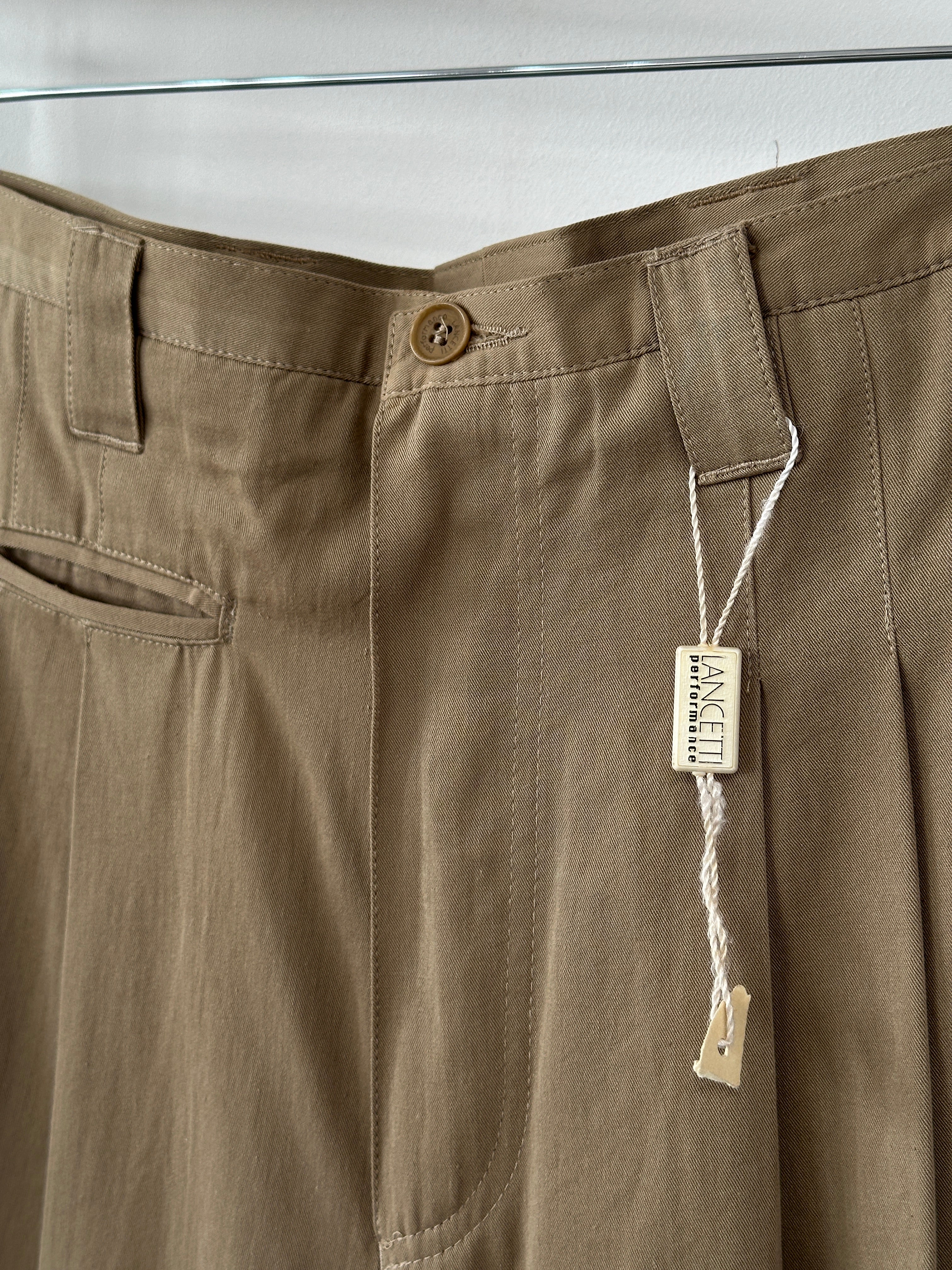 Vintage pure cotton straight leg pleated trousers in size W35, featuring classic design and tailored fit.