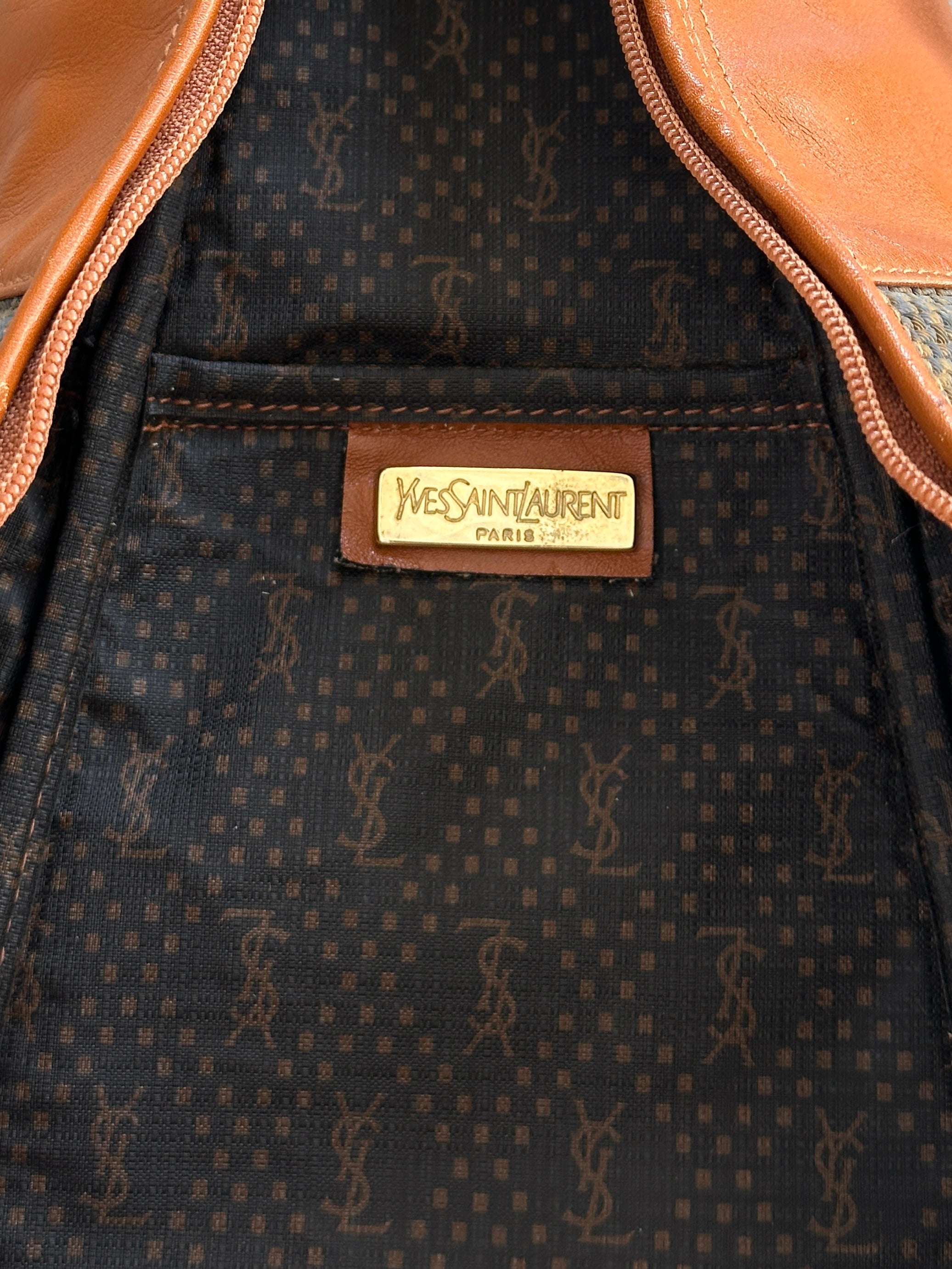 Yves Saint Laurent Paris 80s leather sling bag with sleek design and adjustable strap, showcased in a classic black finish.