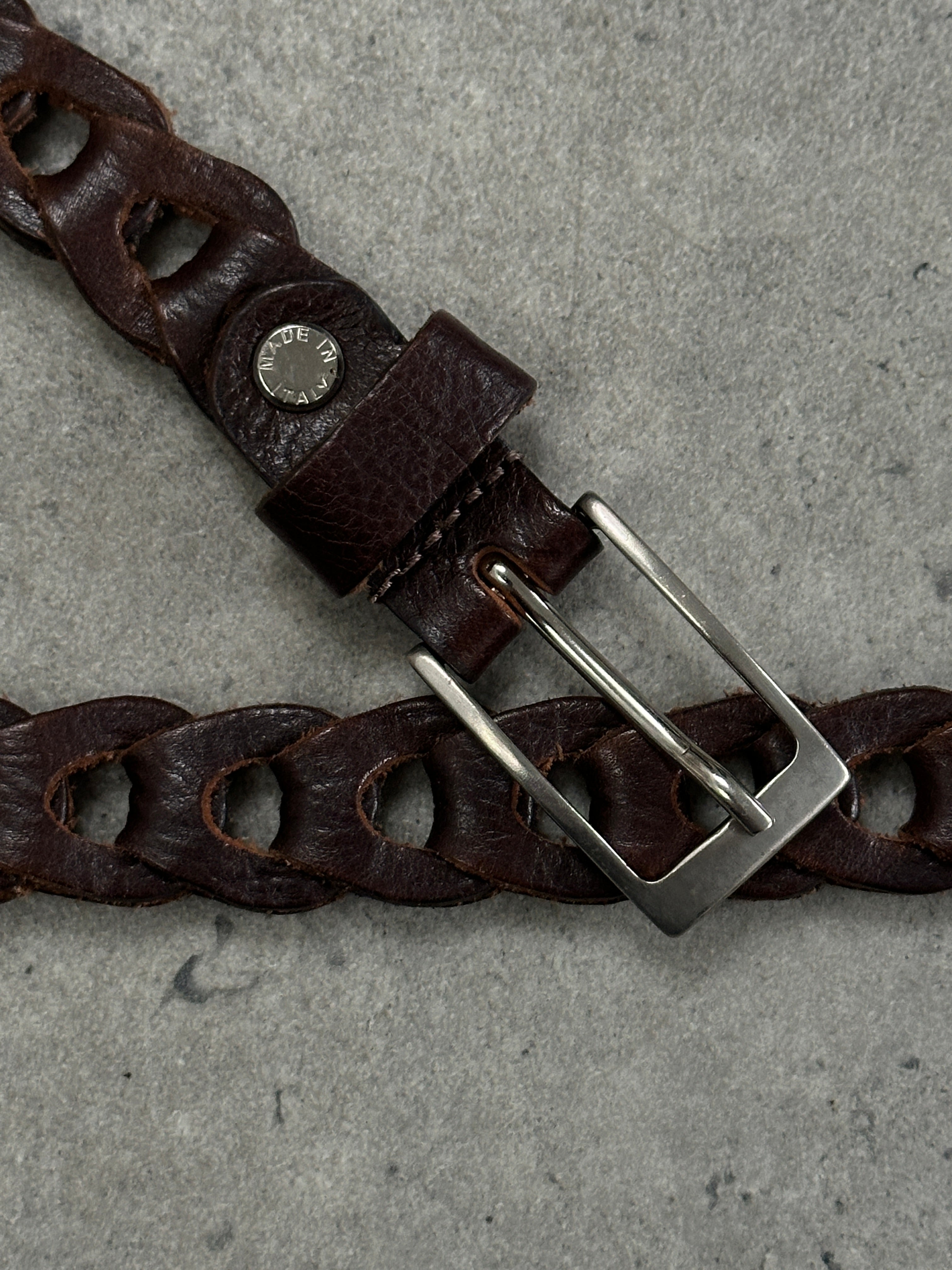 Vintage Italian 1990s leather adjustable belt, one size, with classic buckle and aged leather finish.