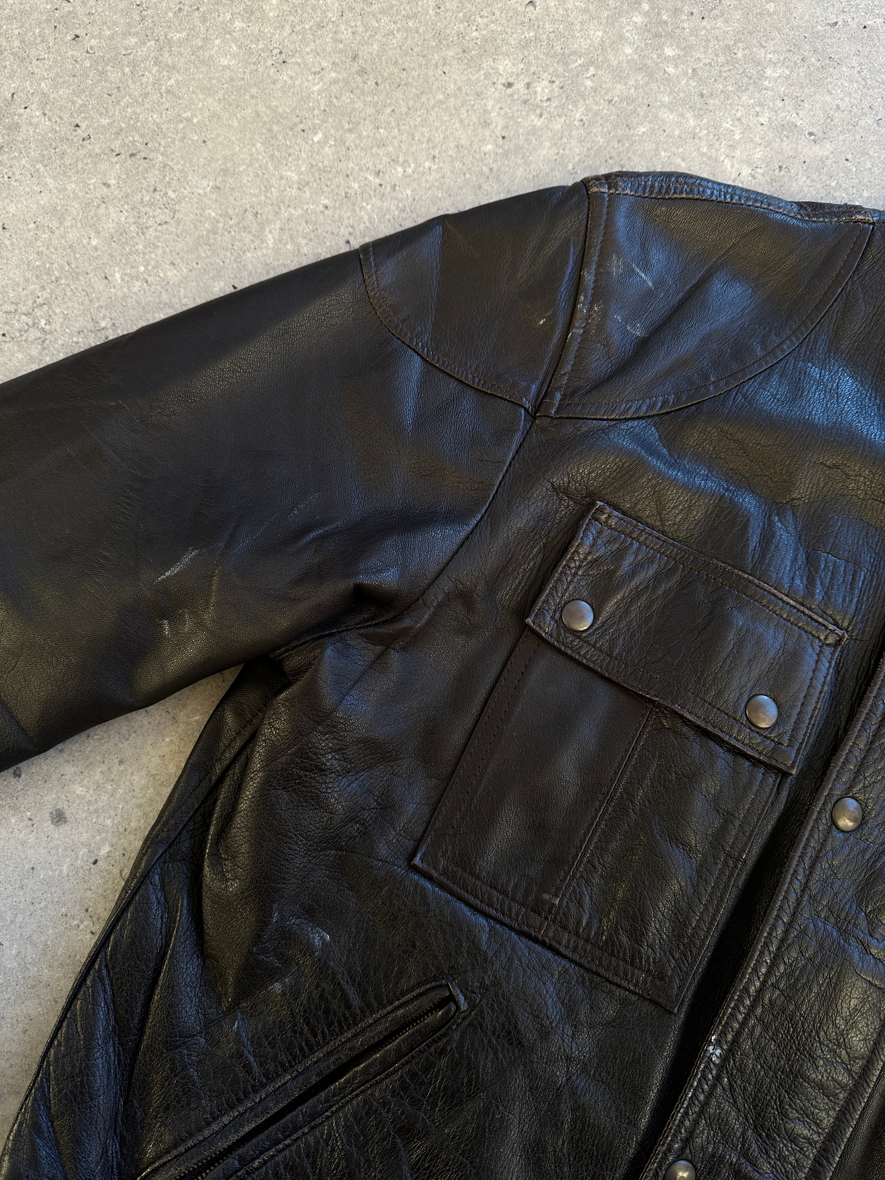 Vintage Italian Moto leather jacket in size S, showcasing classic design with rugged leather and vintage detailing.