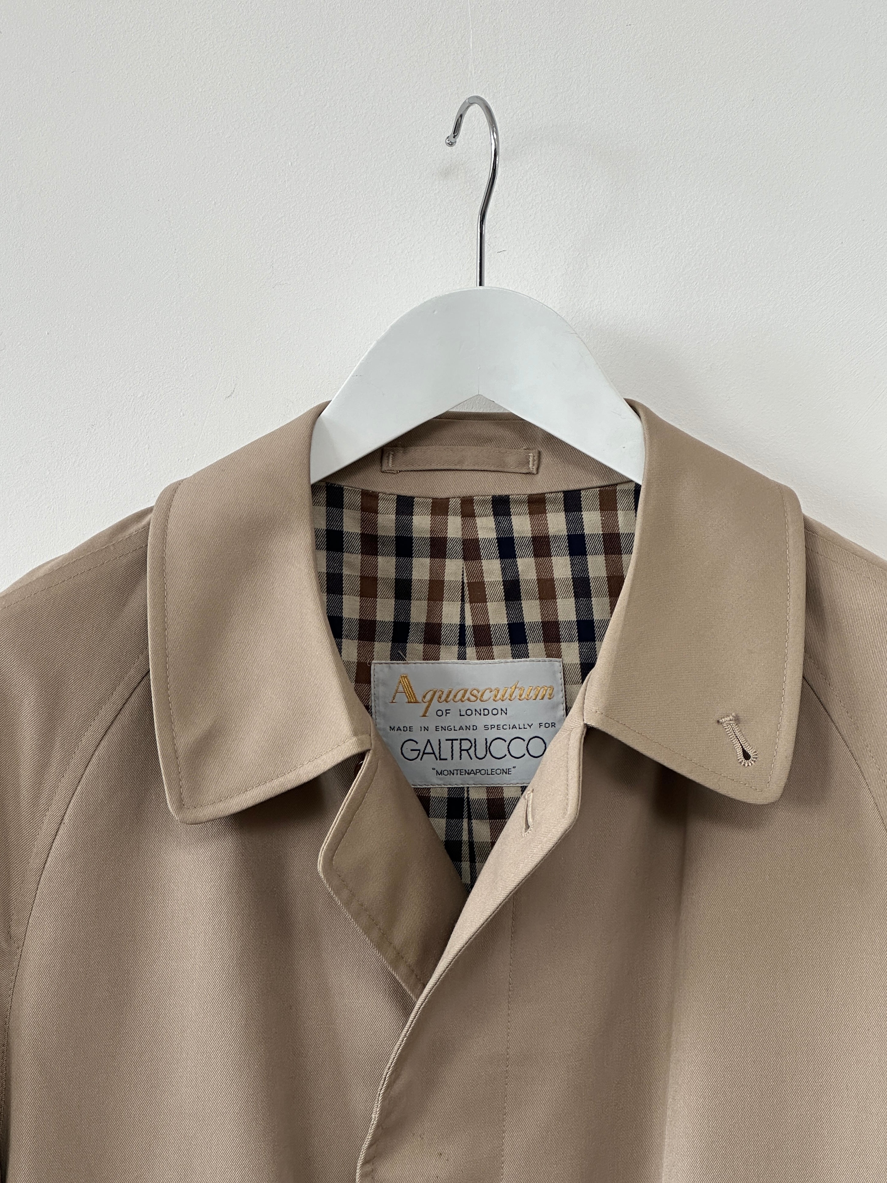 Aquascutum cotton trench coat with concealed placket, XL size, featuring classic design and tailored fit in a neutral color.