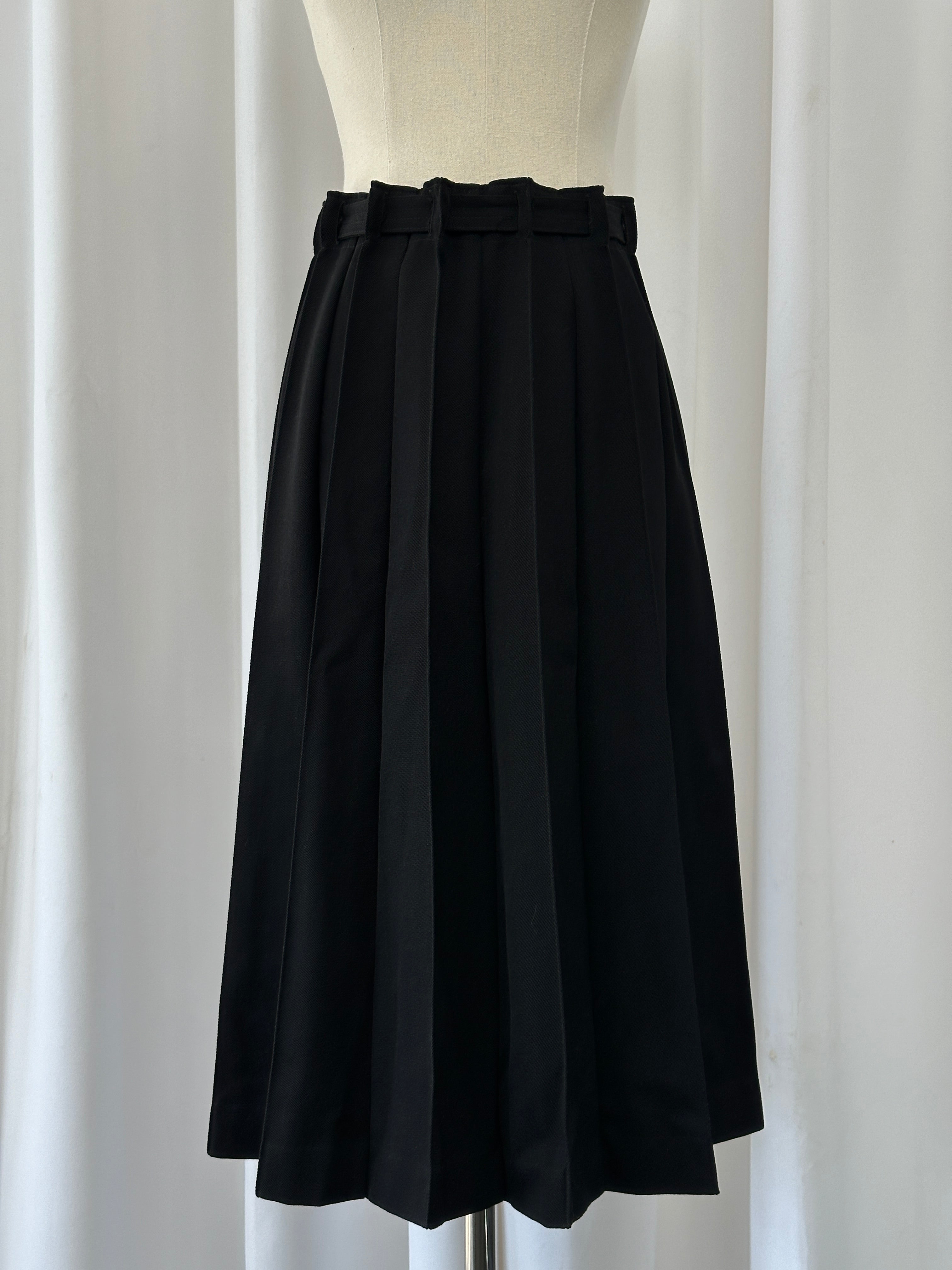 Vintage 1990s wool pleated midi skirt in earthy tones, featuring a high waist and classic A-line silhouette.