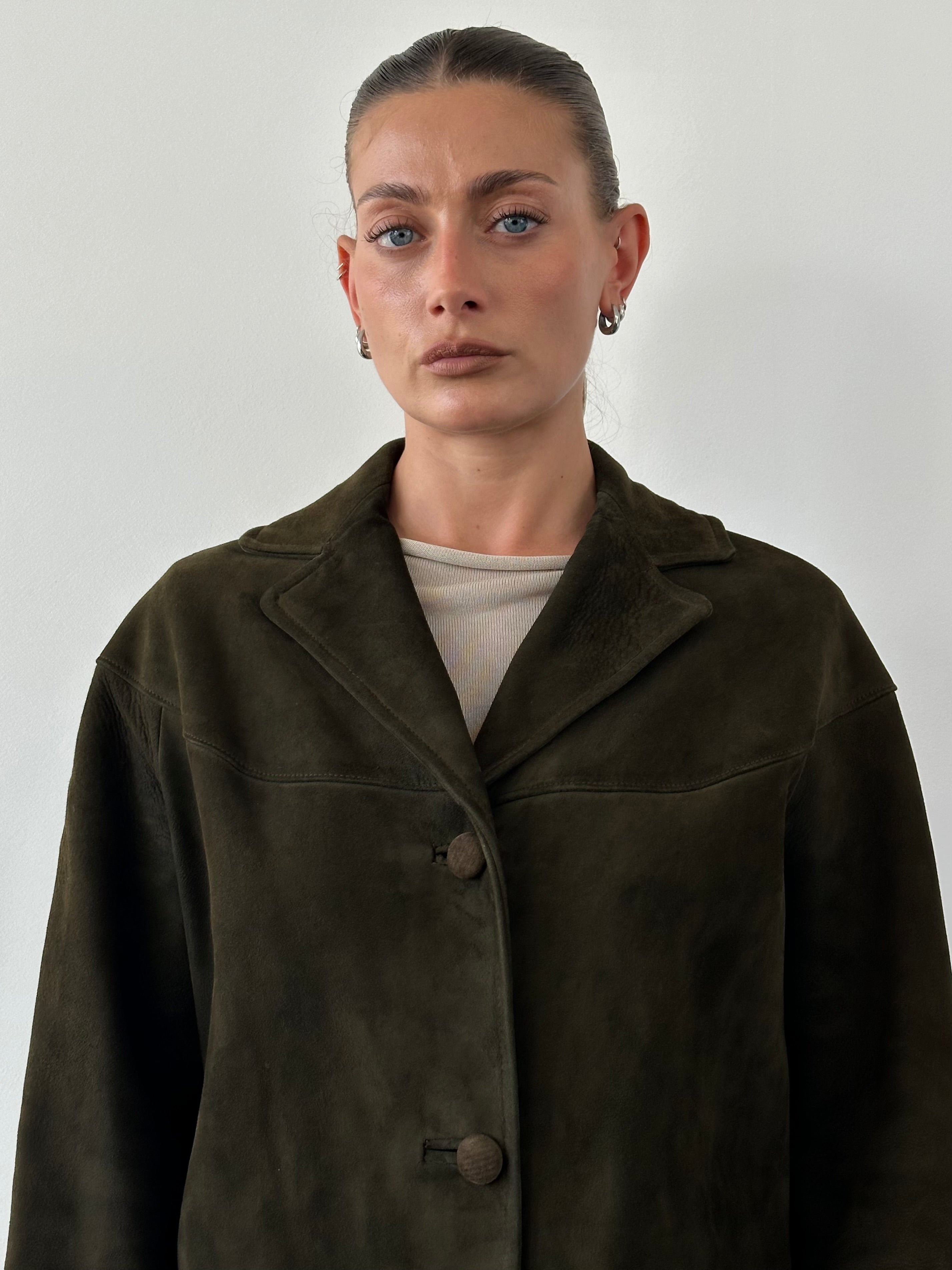Vintage suede blazer jacket in size M, featuring classic tailored fit and stylish design, displayed on a hanger.
