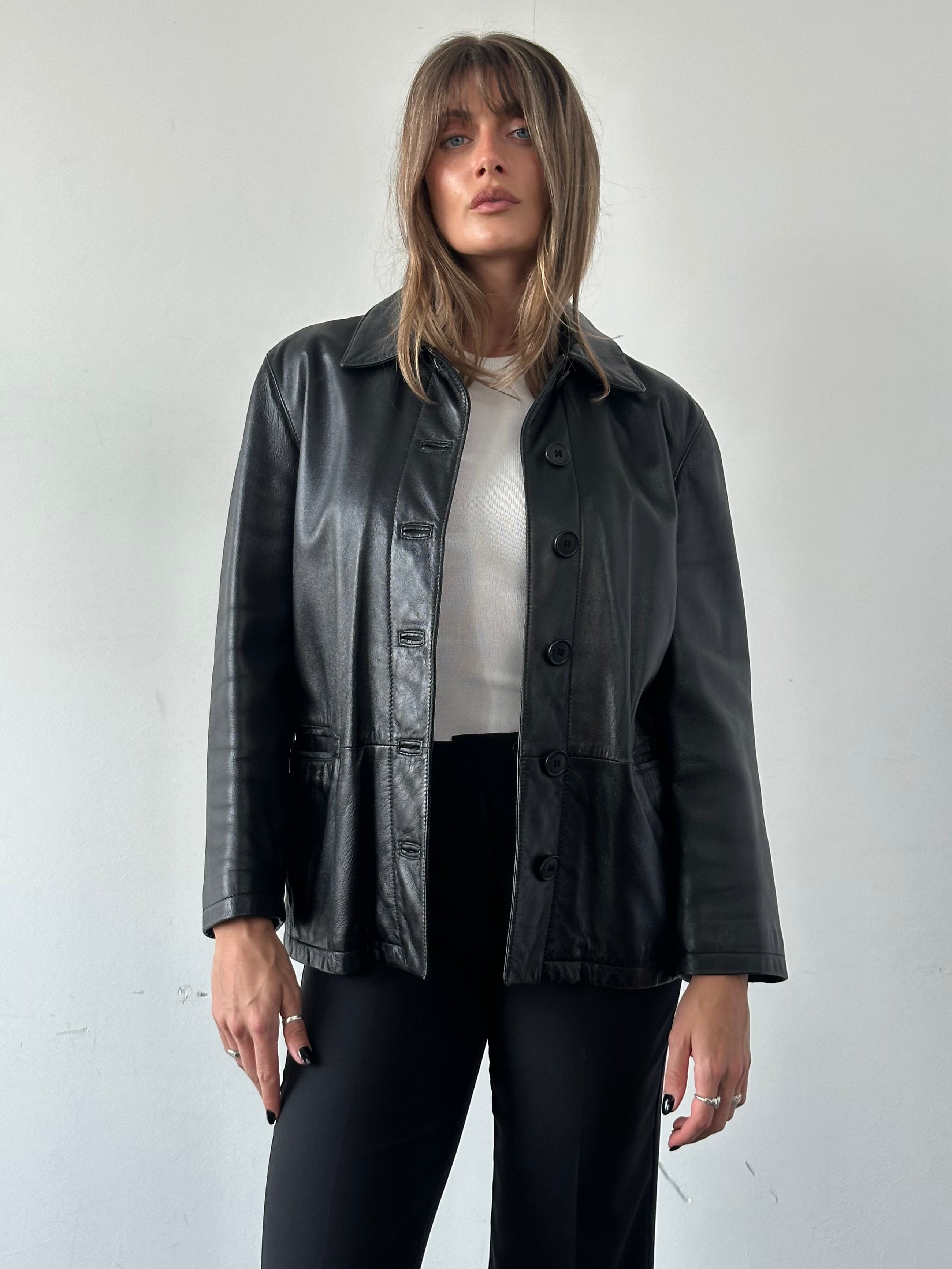 Armani Jeans men's leather jacket with button-up front, classic black design, and stylish collar detail.