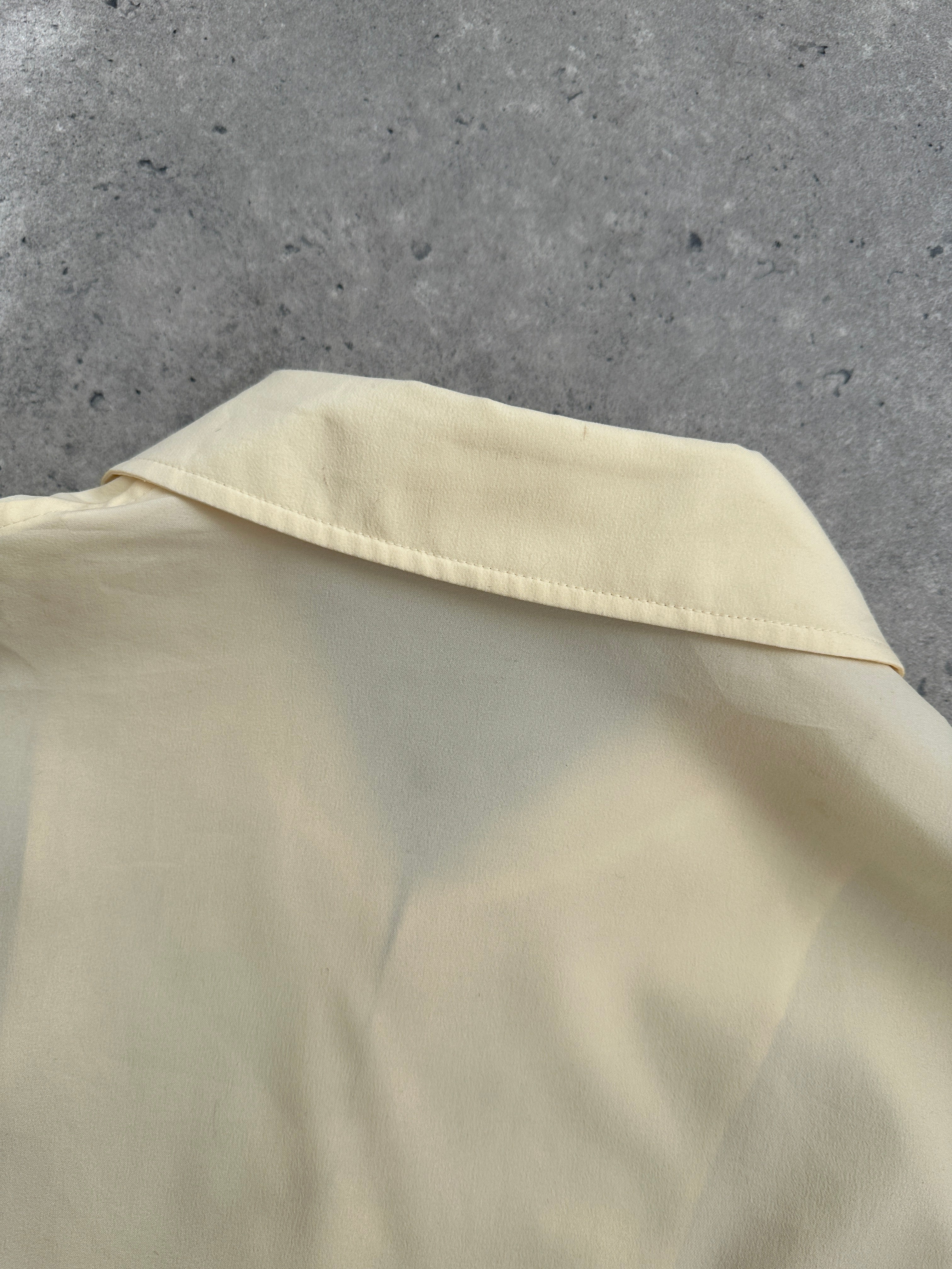 Yves Saint Laurent Pour Homme logo bomber jacket in size L, black with YSL branding on the chest and ribbed cuffs.