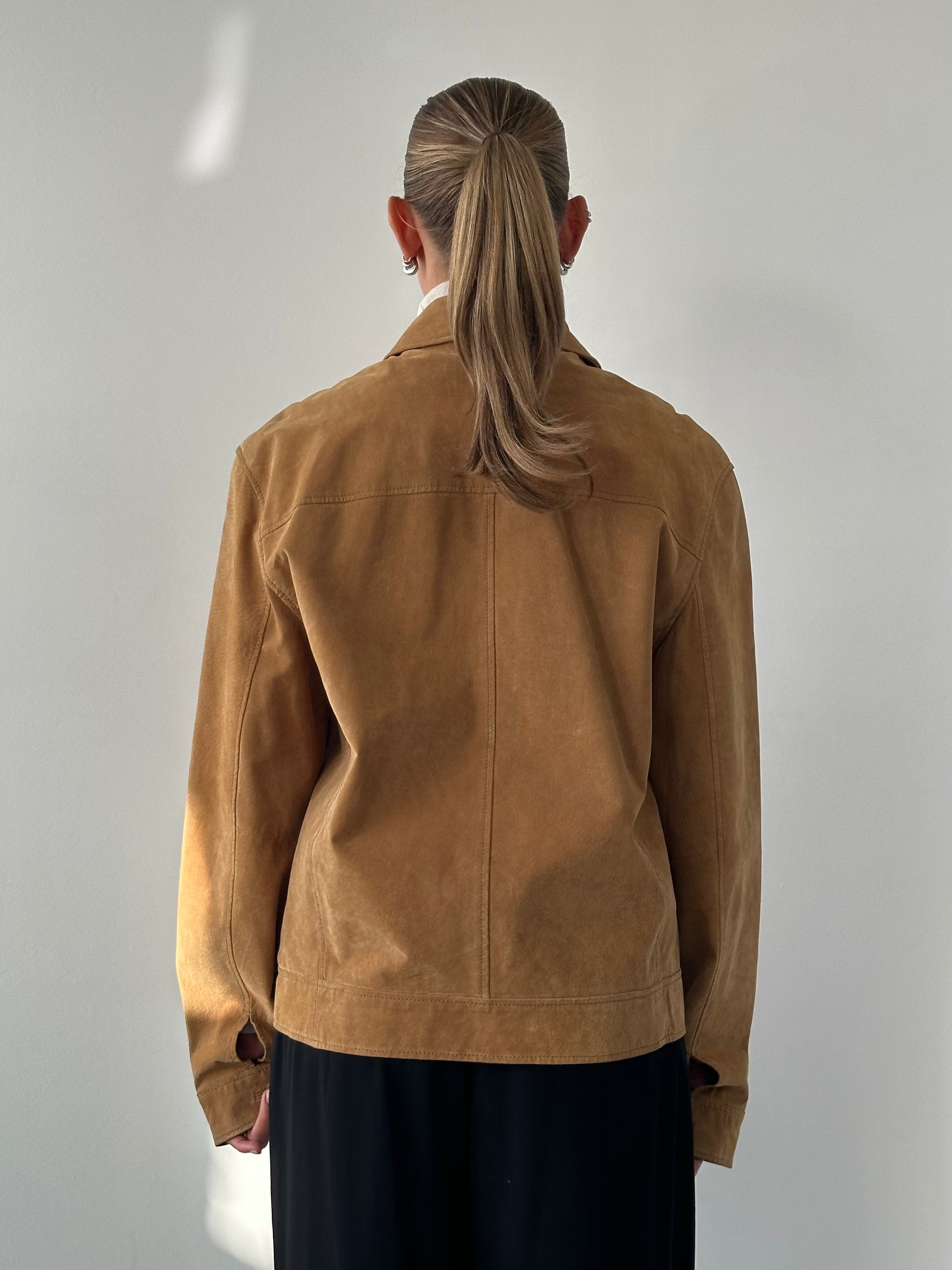 Vintage suede trucker jacket in size M/L, featuring classic design with a rugged, stylish look and authentic suede material.