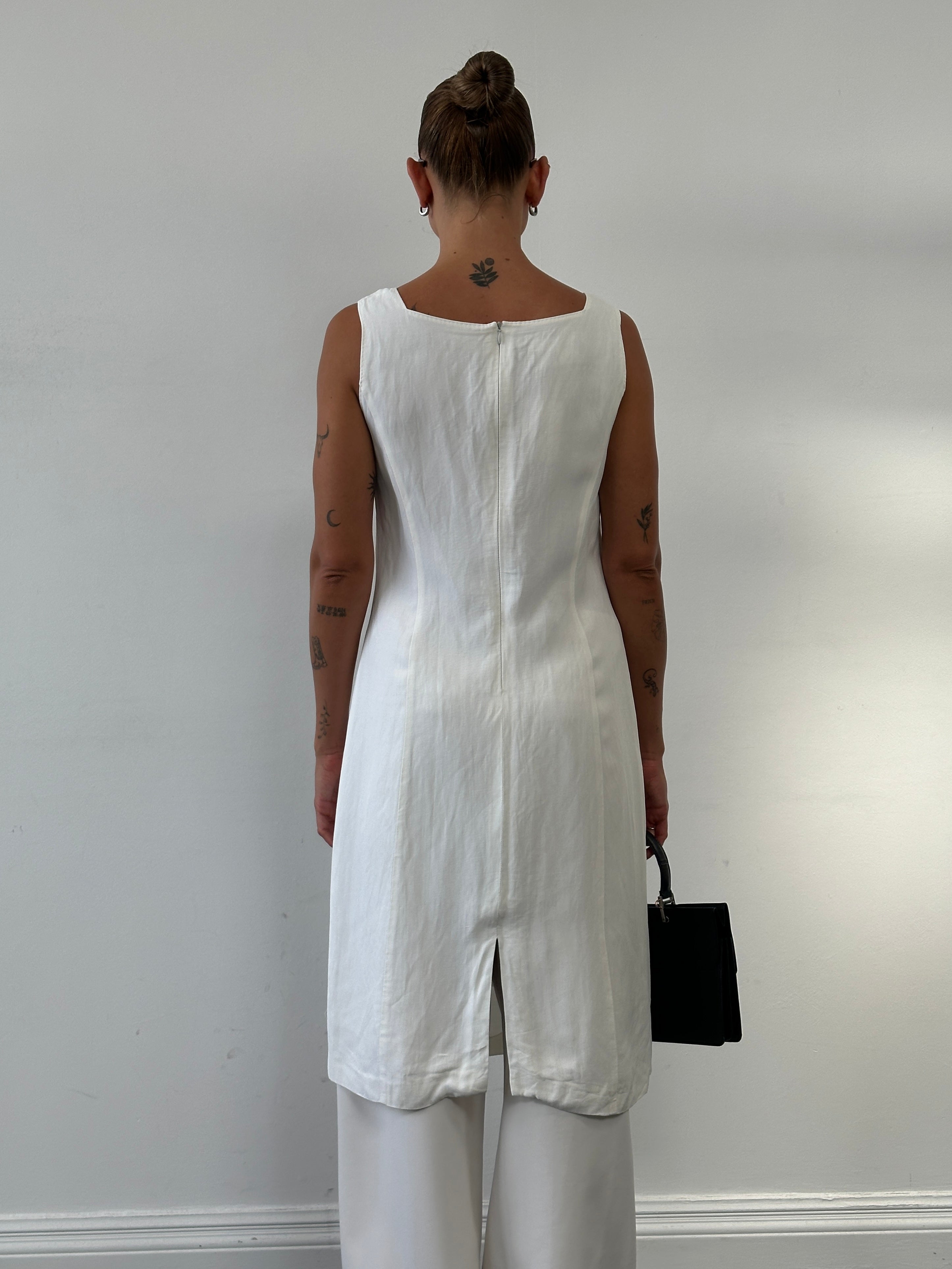 Max Mara linen square neck midi dress in M/L displayed on a hanger, showcasing its elegant design and lightweight fabric.