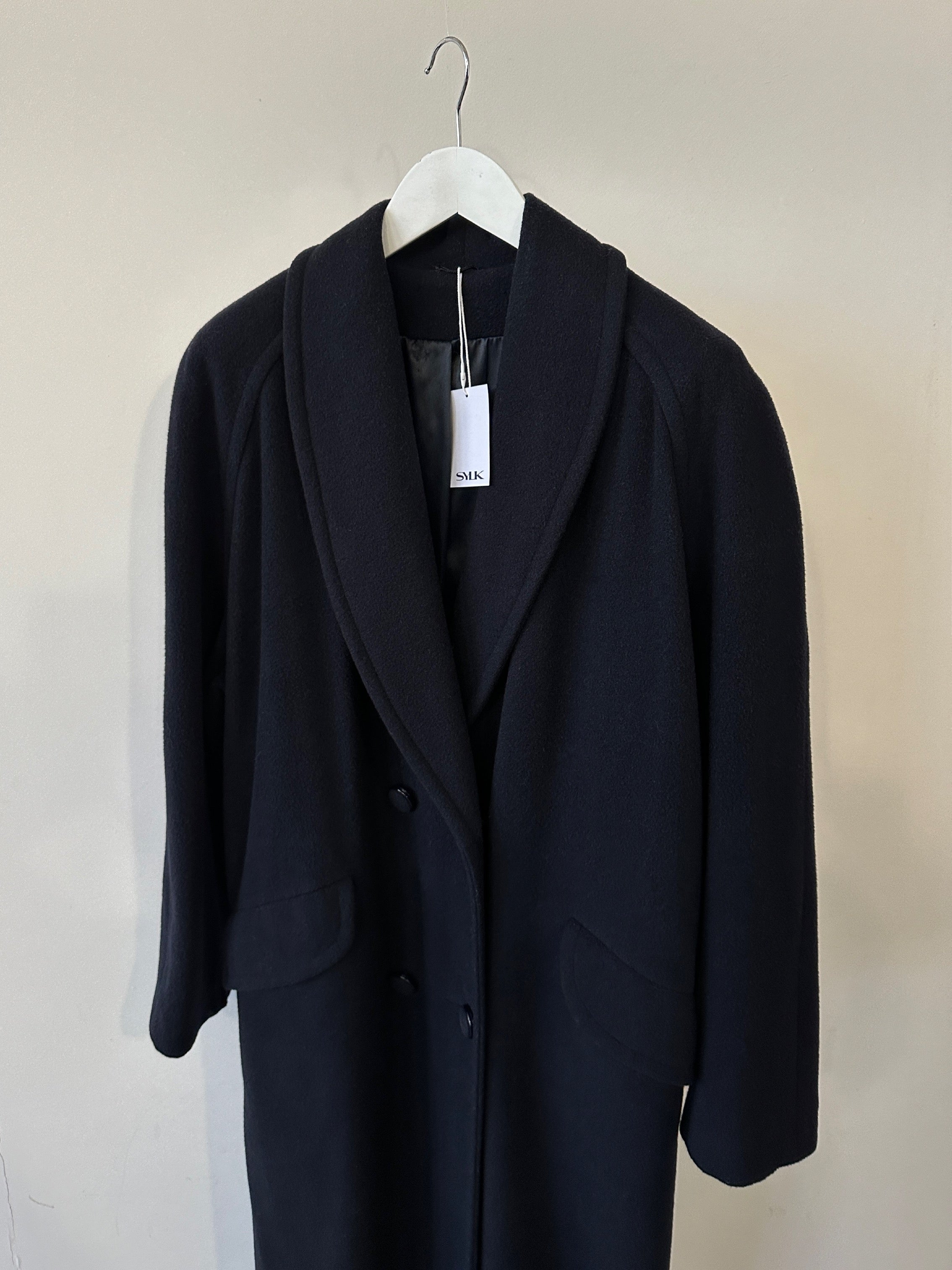Vintage British double-breasted wool cashmere coat in size M, showcasing classic design with tailored lapels and button details.