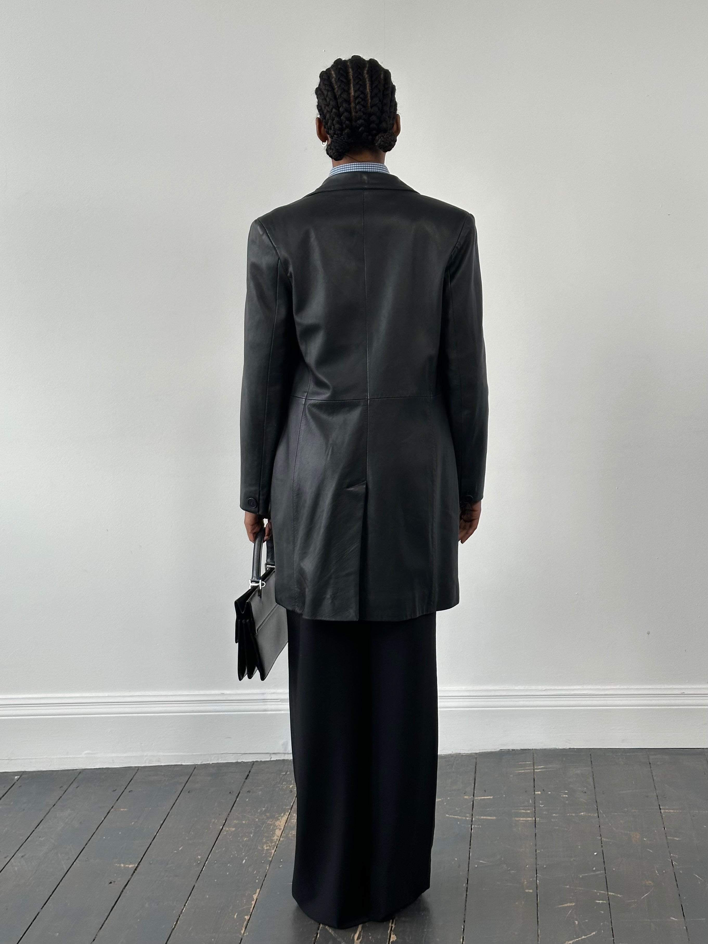 St Michael 1990s lambskin smooth leather trench coat in size M, shown on a hanger with front view and detailed collar.