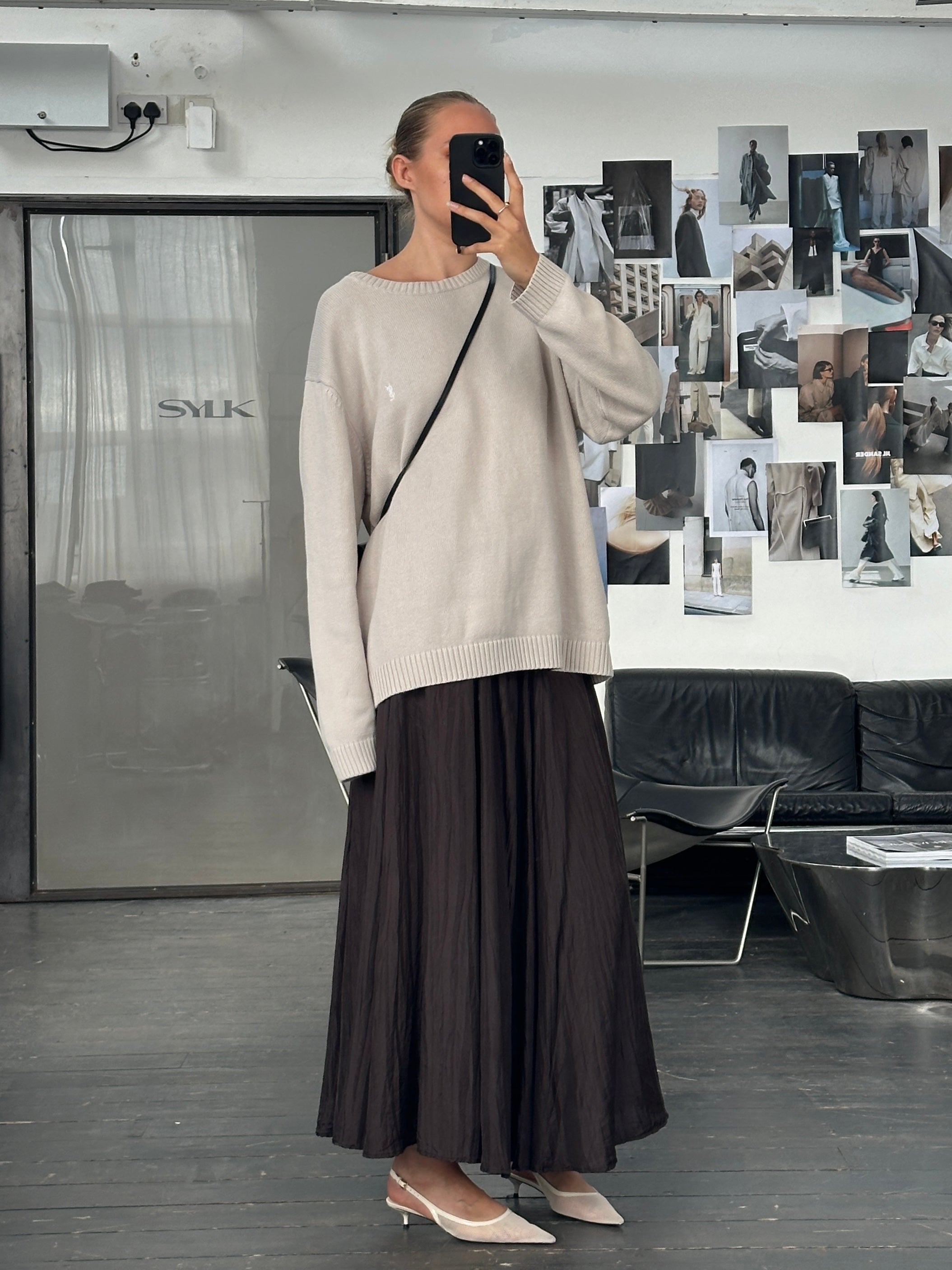 Vintage 1990s pure silk crinkle midi skirt in natural tones, featuring a flowing silhouette and elastic waistband.