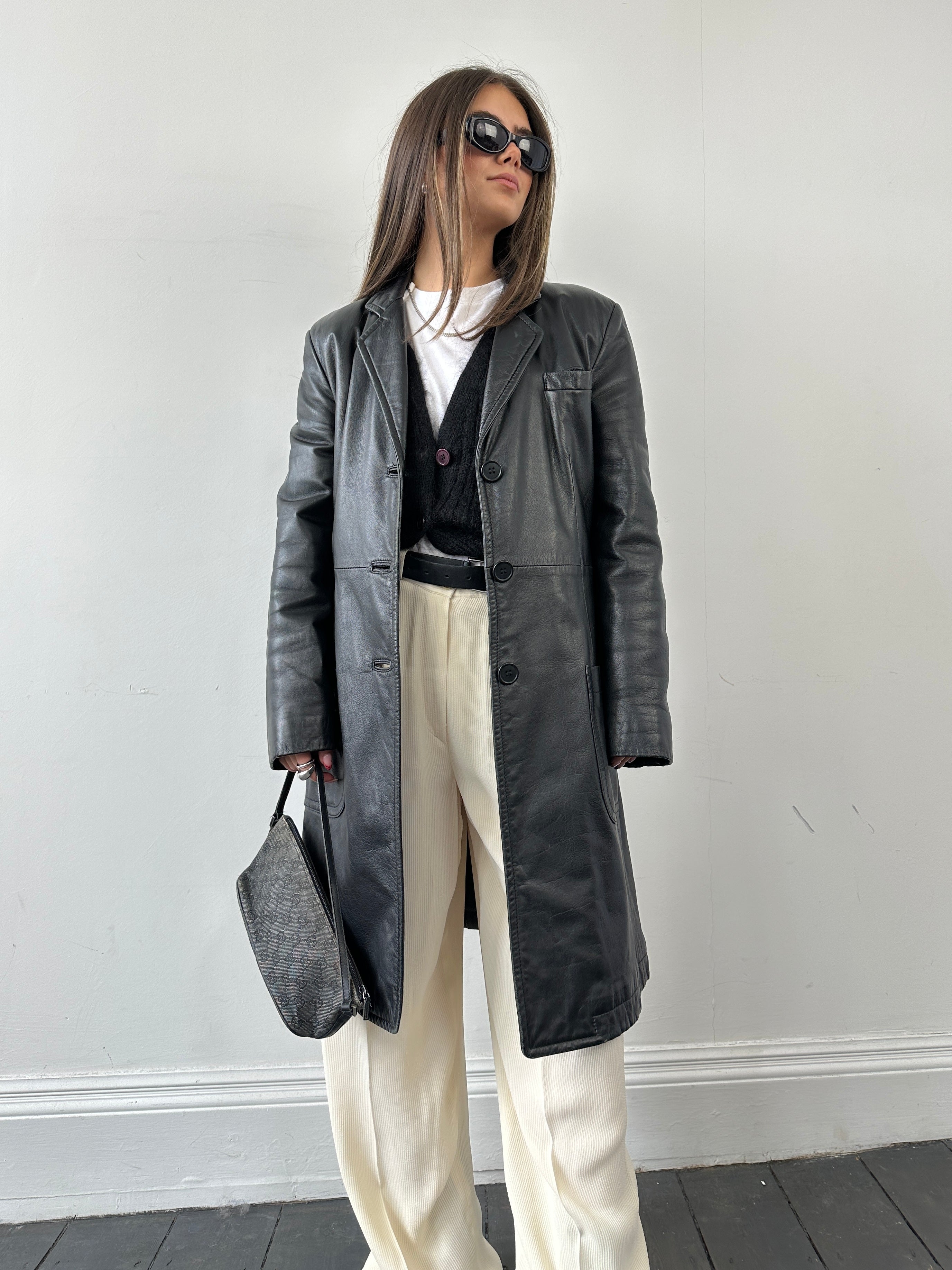 Armani leather trench coat in size XS, stylish men's or women's jacket with sleek black leather and classic trench design.