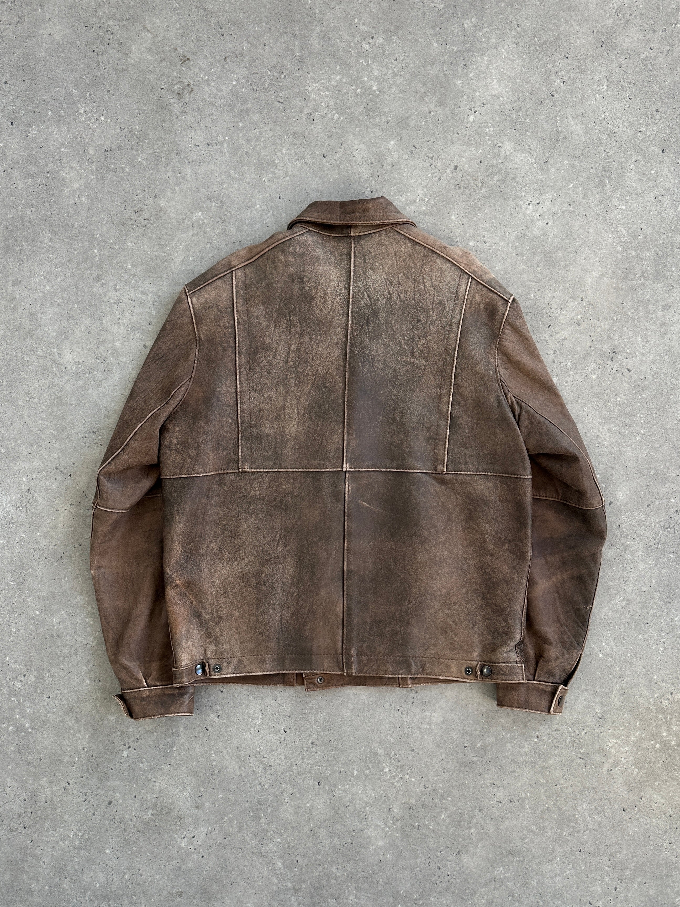 Vintage British vintage aged leather biker jacket in size M/L showing distressed leather with classic biker collar and metal hardware.