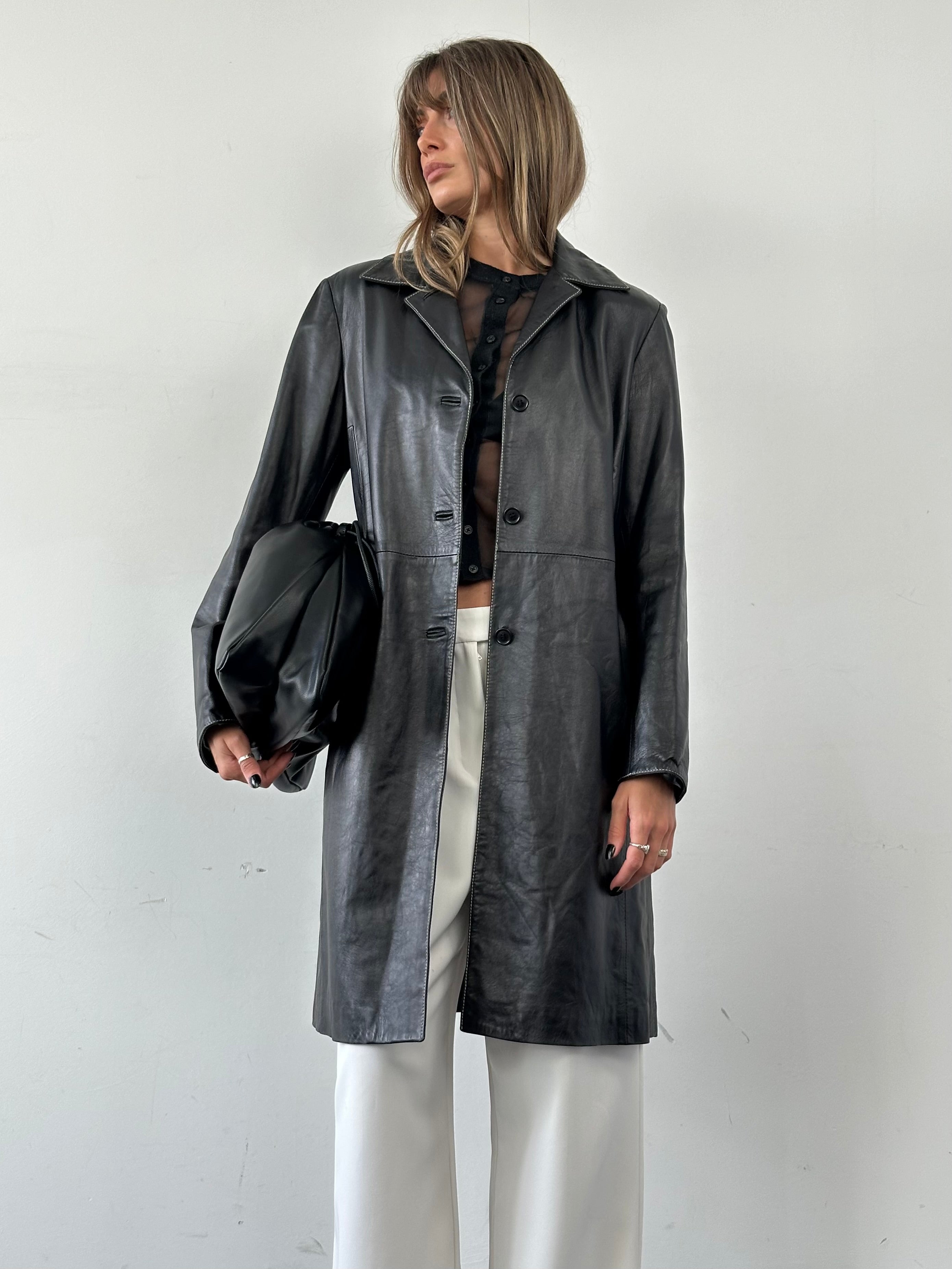 Conbipel contrast stitch leather trench coat for men and women, featuring sleek design and stylish details.