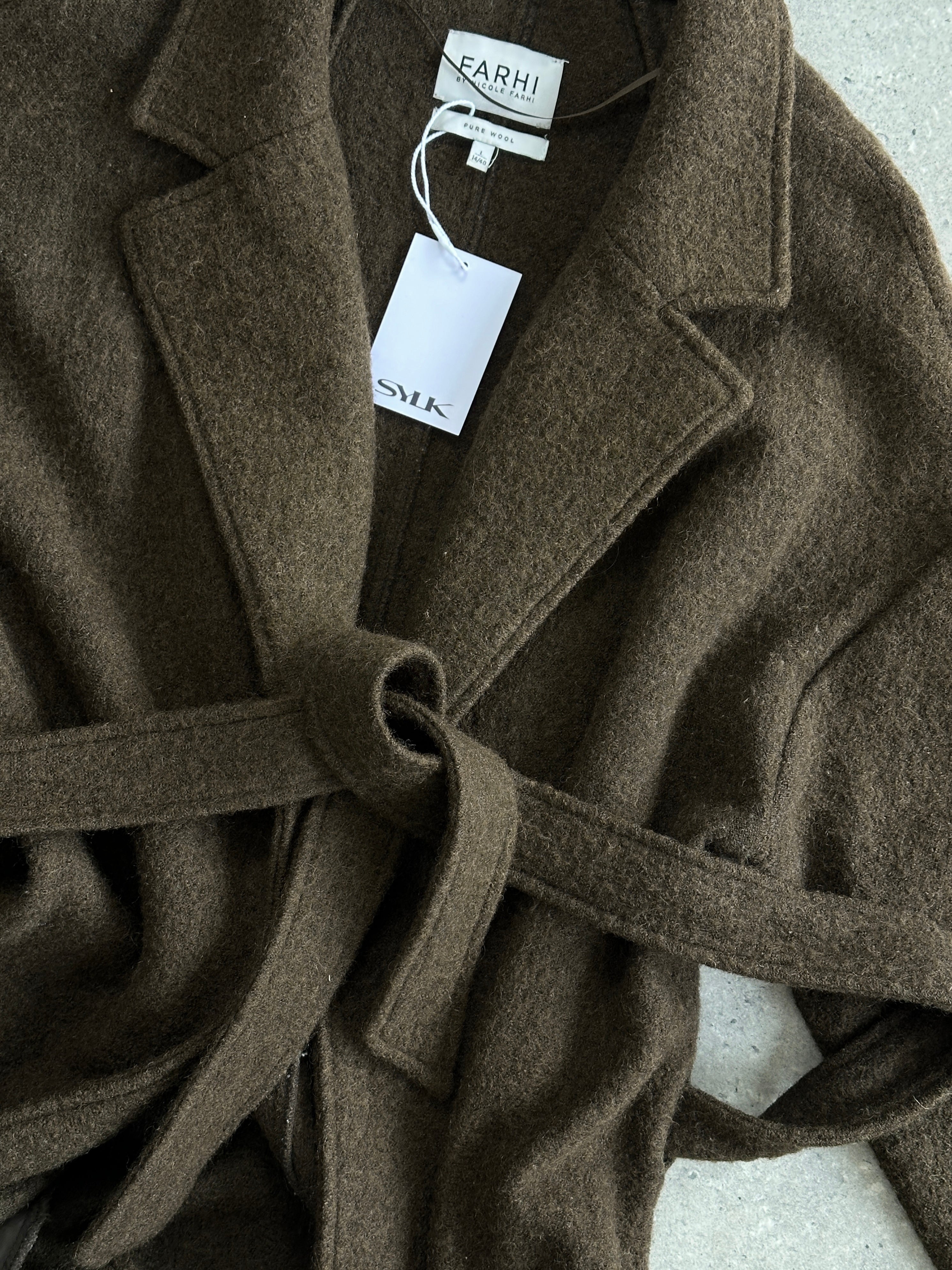 Nicole Farhi pure wool unlined belted wrap coat in size L, shown open on a model with neutral background.