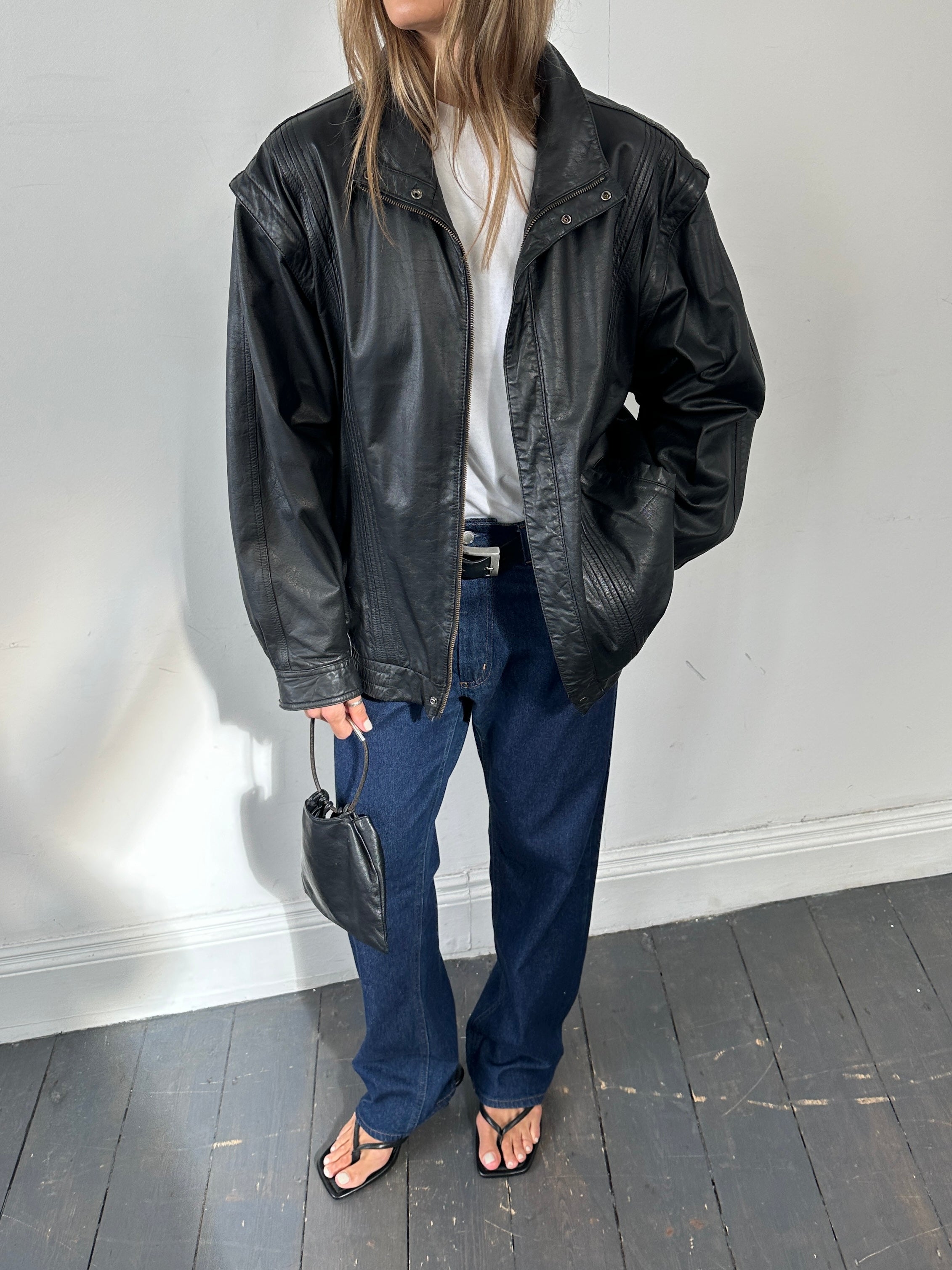 Vintage leather bomber gilet jacket in XL size, featuring classic design and durable leather material.