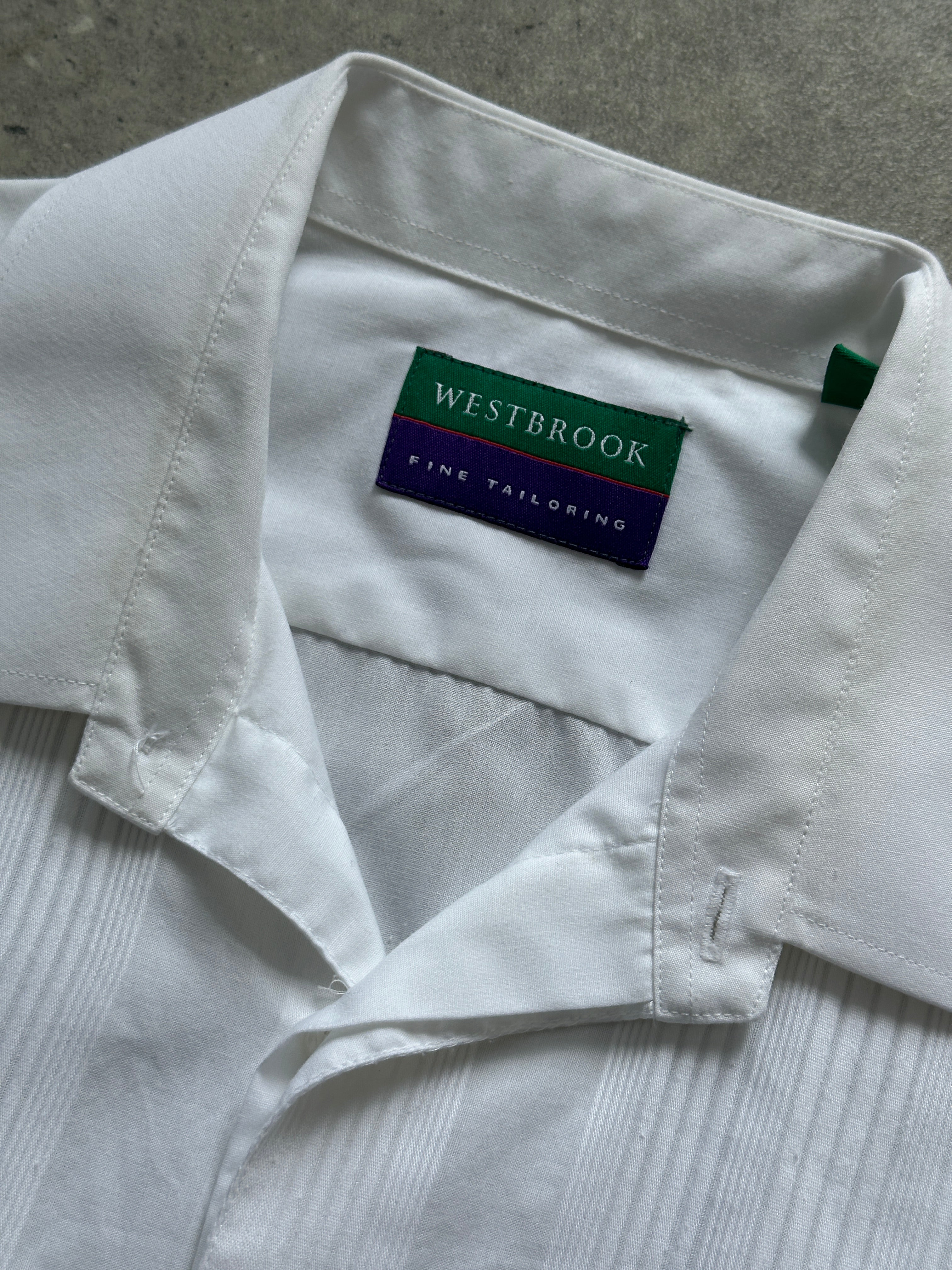Vintage cotton pleated tuxedo dress shirt, XL size, featuring classic pleats and a tailored fit, displayed on a hanger.