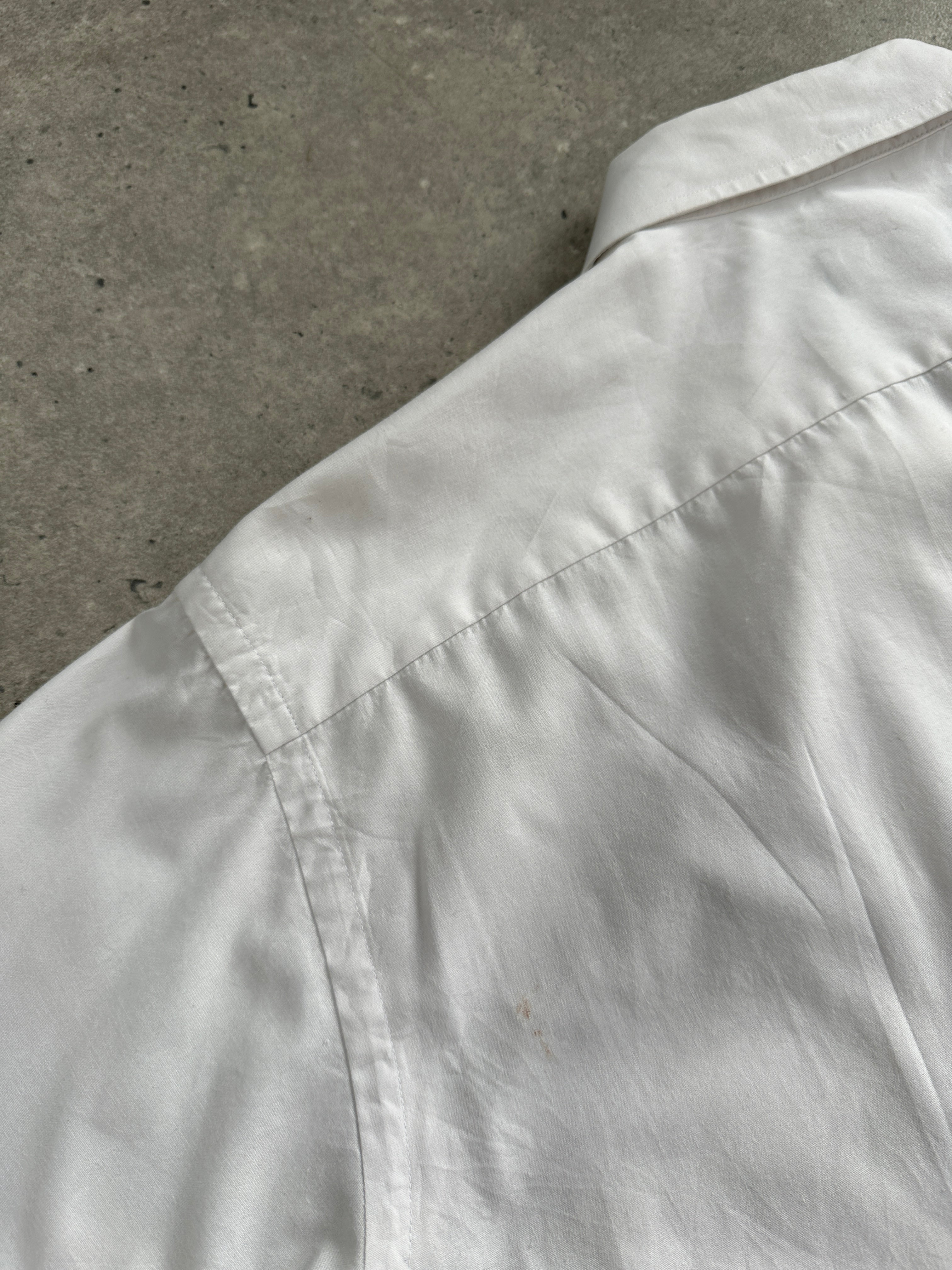Christian Dior Monsieur cotton dress shirt in size L, tailored fit with classic collar and button-down front, displayed on a hanger.