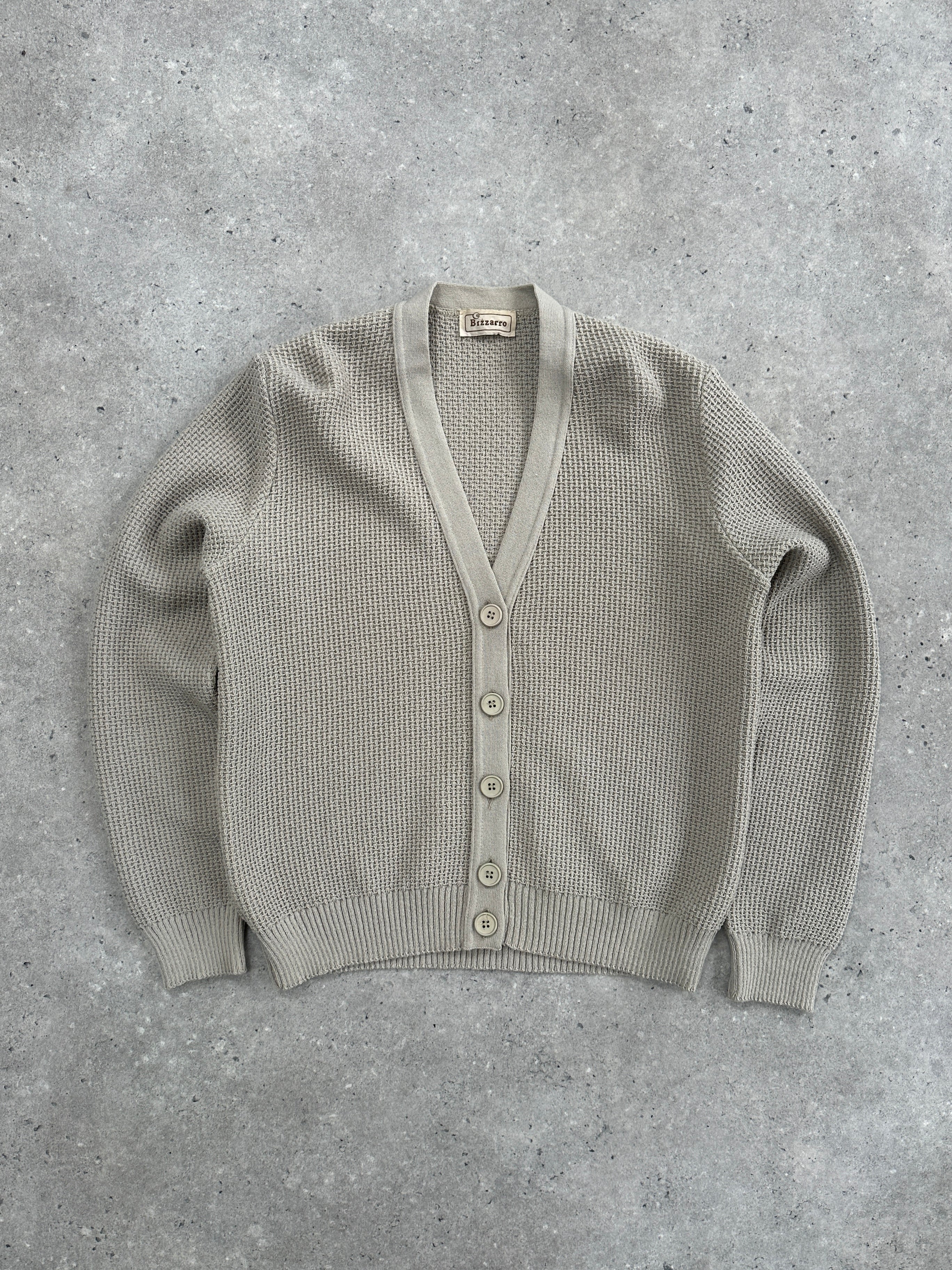 Vintage pure wool knitted cardigan in size S, featuring a cozy, textured knit design and classic button-front style.