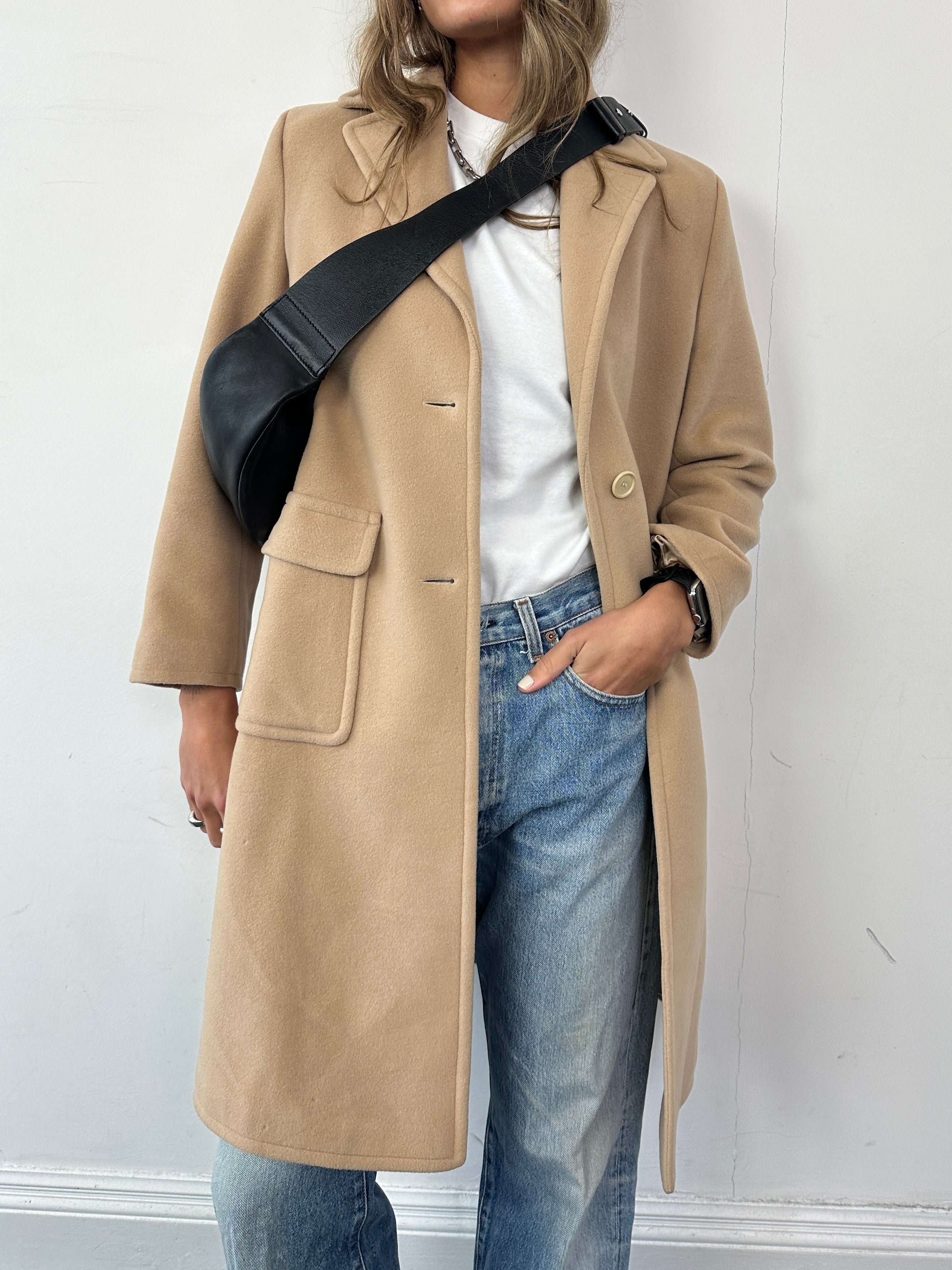 Hugo Boss pure wool single-breasted coat in size S, shown on a hanger with a tailored fit and classic collar style.
