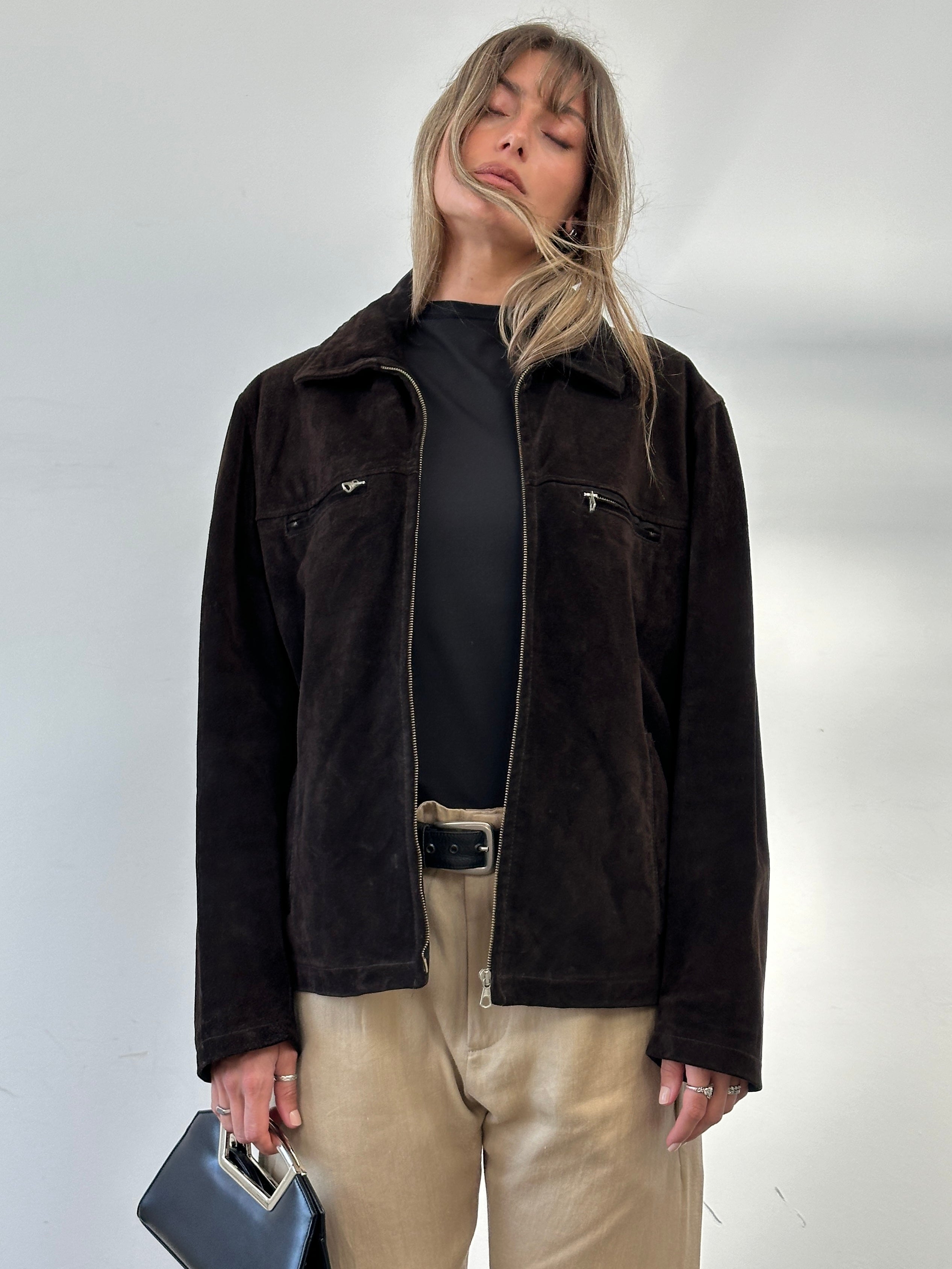 Vintage boxy suede jacket in brown with a classic collar and button closure, displayed on a hanger.