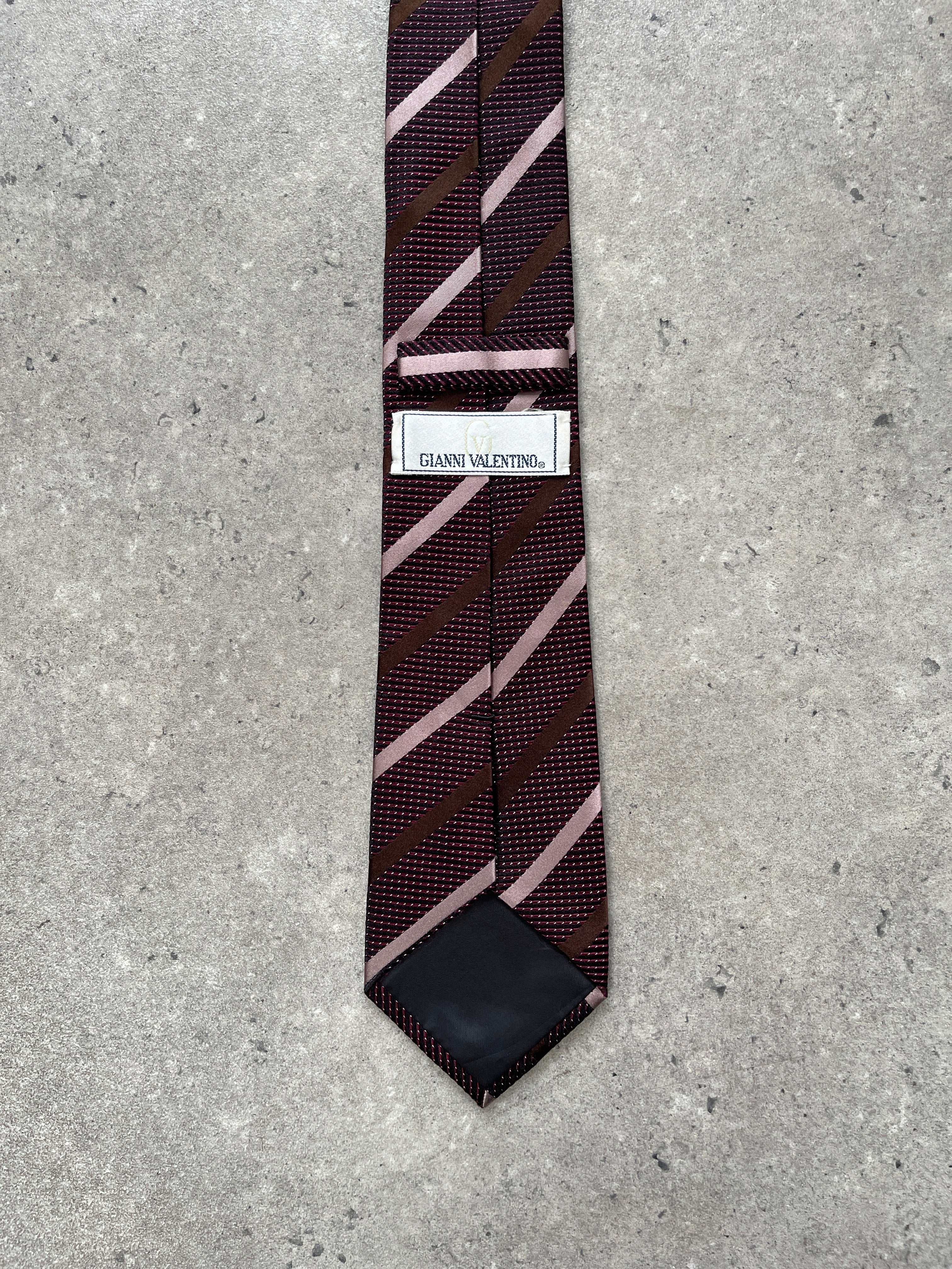 Vintage 1990s pure silk diagonal stripe tie with classic pattern, showcasing rich colors and smooth fabric.