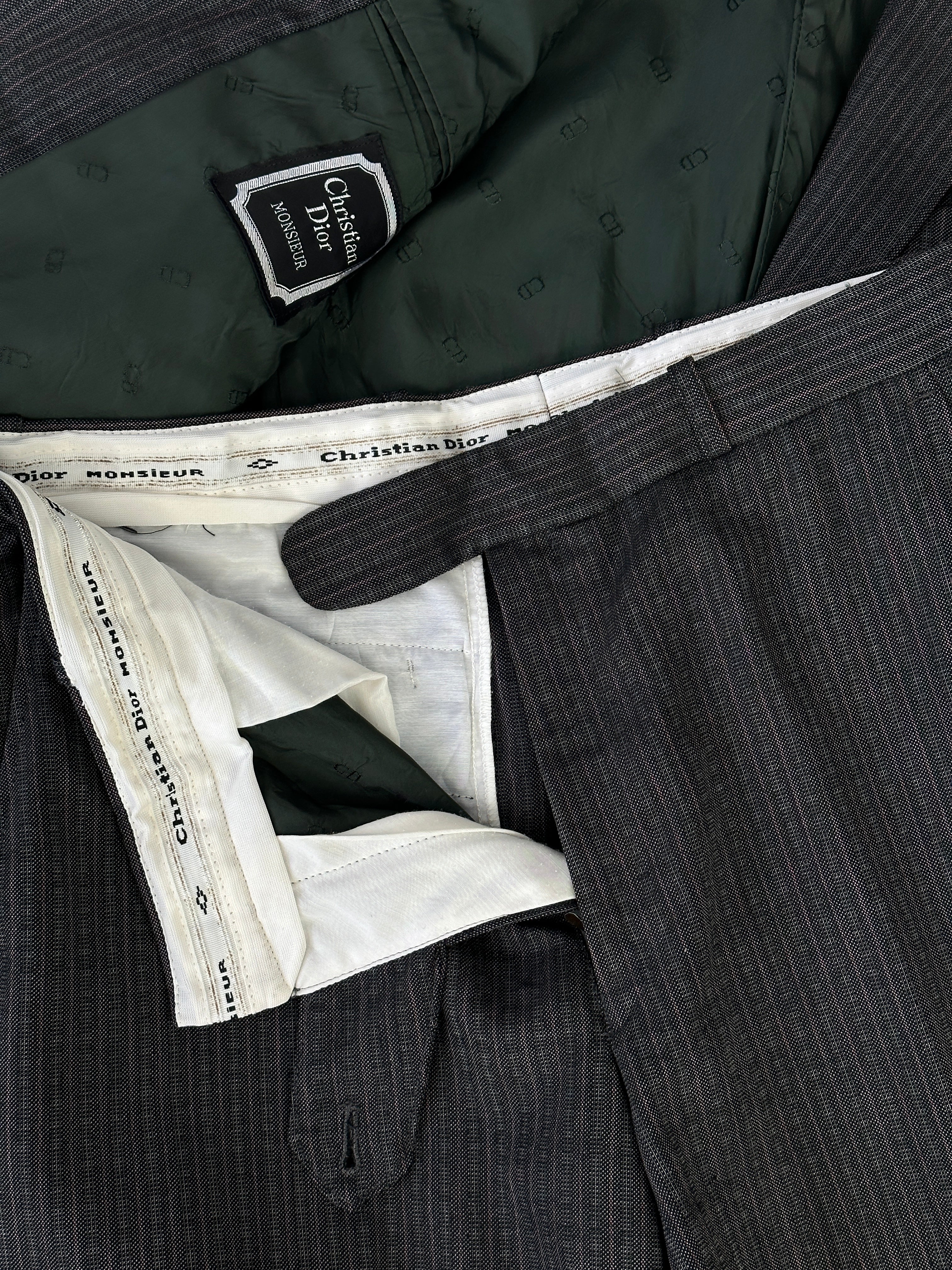 Christian Dior pinstripe single-breasted pure wool suit jumpsuit in size 40R/W32, tailored with classic pinstripe design.