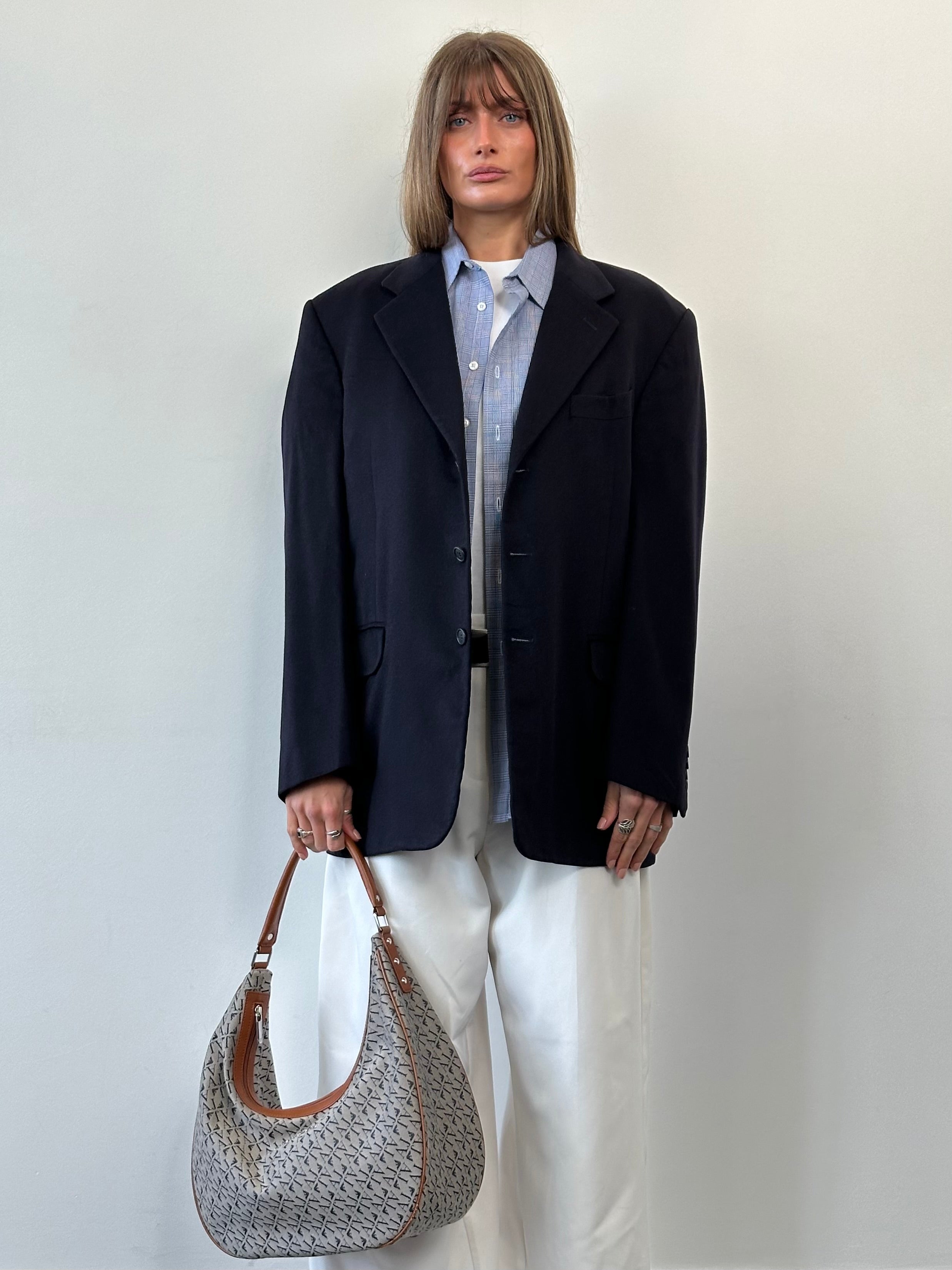 Vintage Italian vintage pure cashmere single-breasted blazer in size 42R/XL, displayed on a hanger with a classic tailored fit.