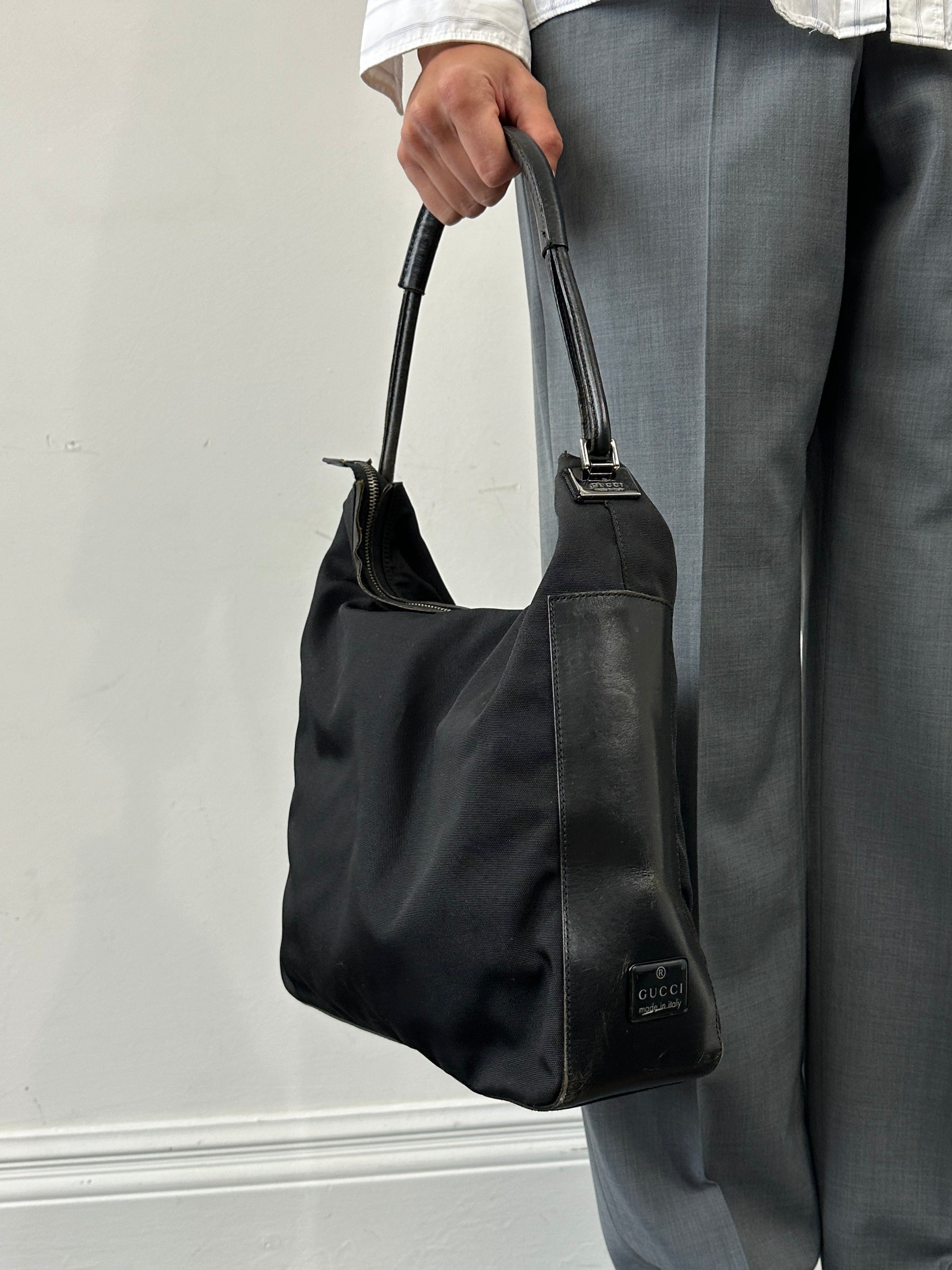Gucci 1990s Tom Ford canvas and leather hobo shoulder bag with slouchy design and vintage logo details.