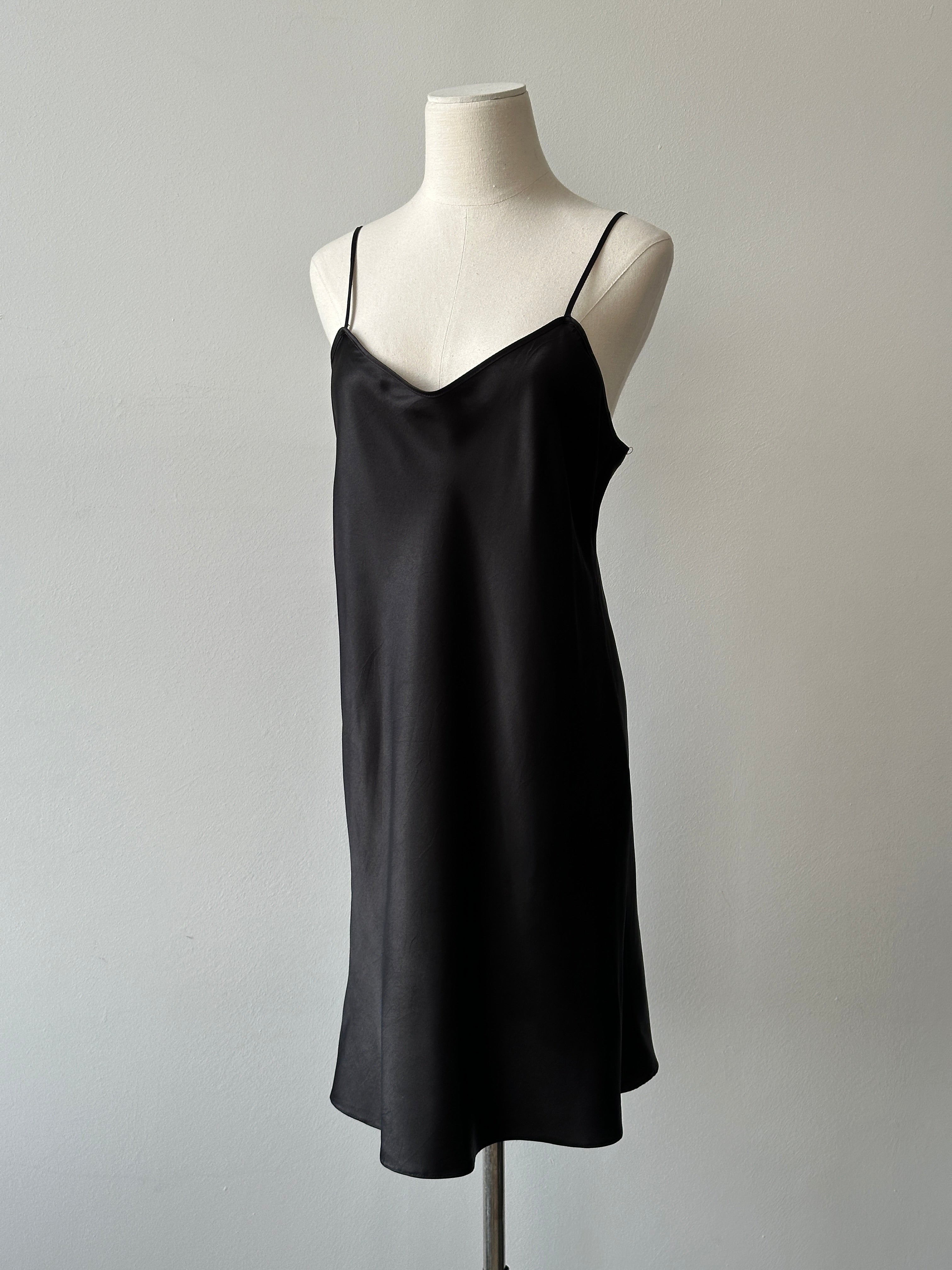 Vintage 1990s satin sleeveless dress in size M featuring a smooth, shiny fabric and elegant sleeveless design.
