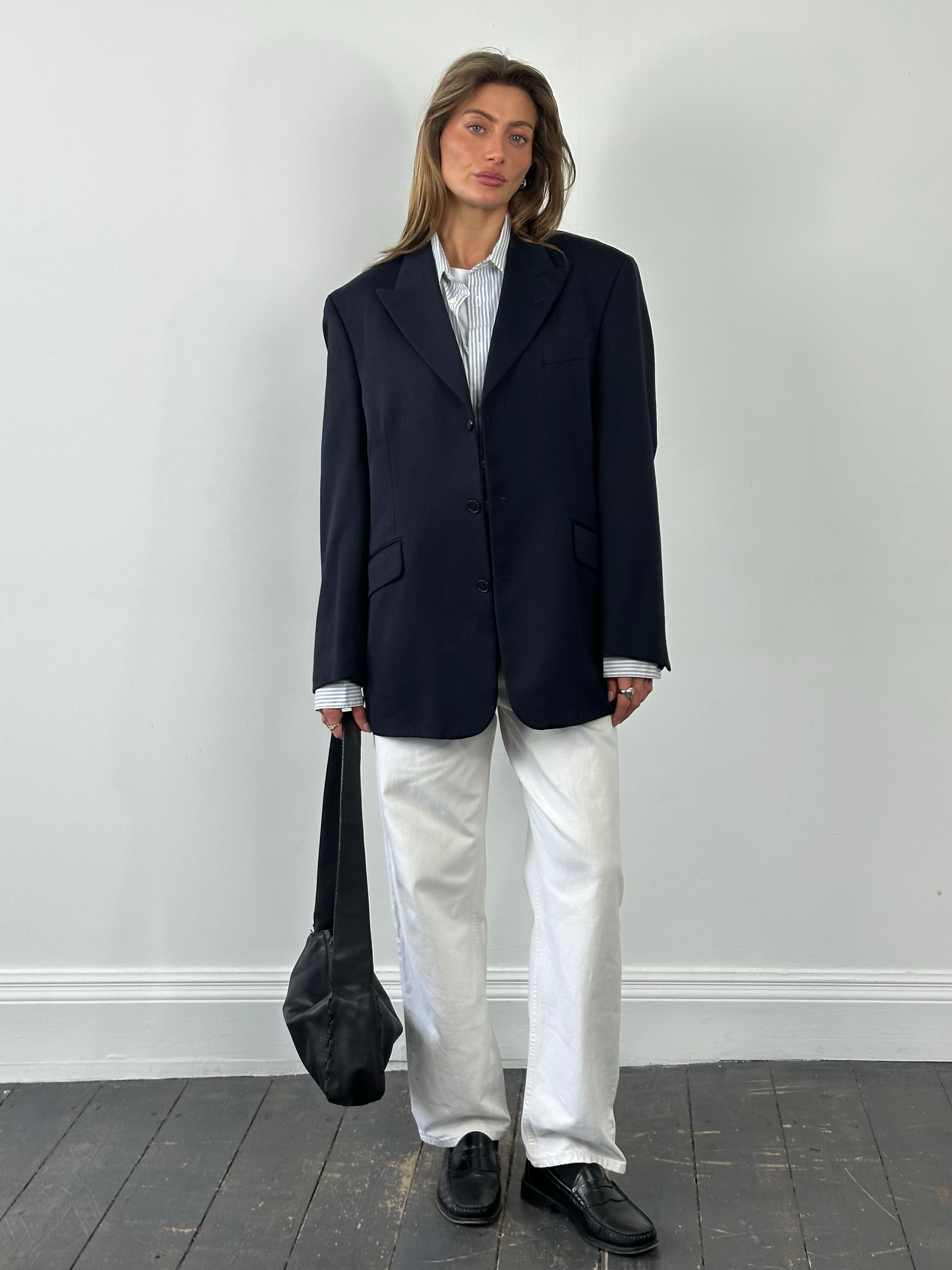 Yves Saint Laurent 1990s pure wool single-breasted blazer in L/XL, showing the tailored fit and classic design in a neutral color.