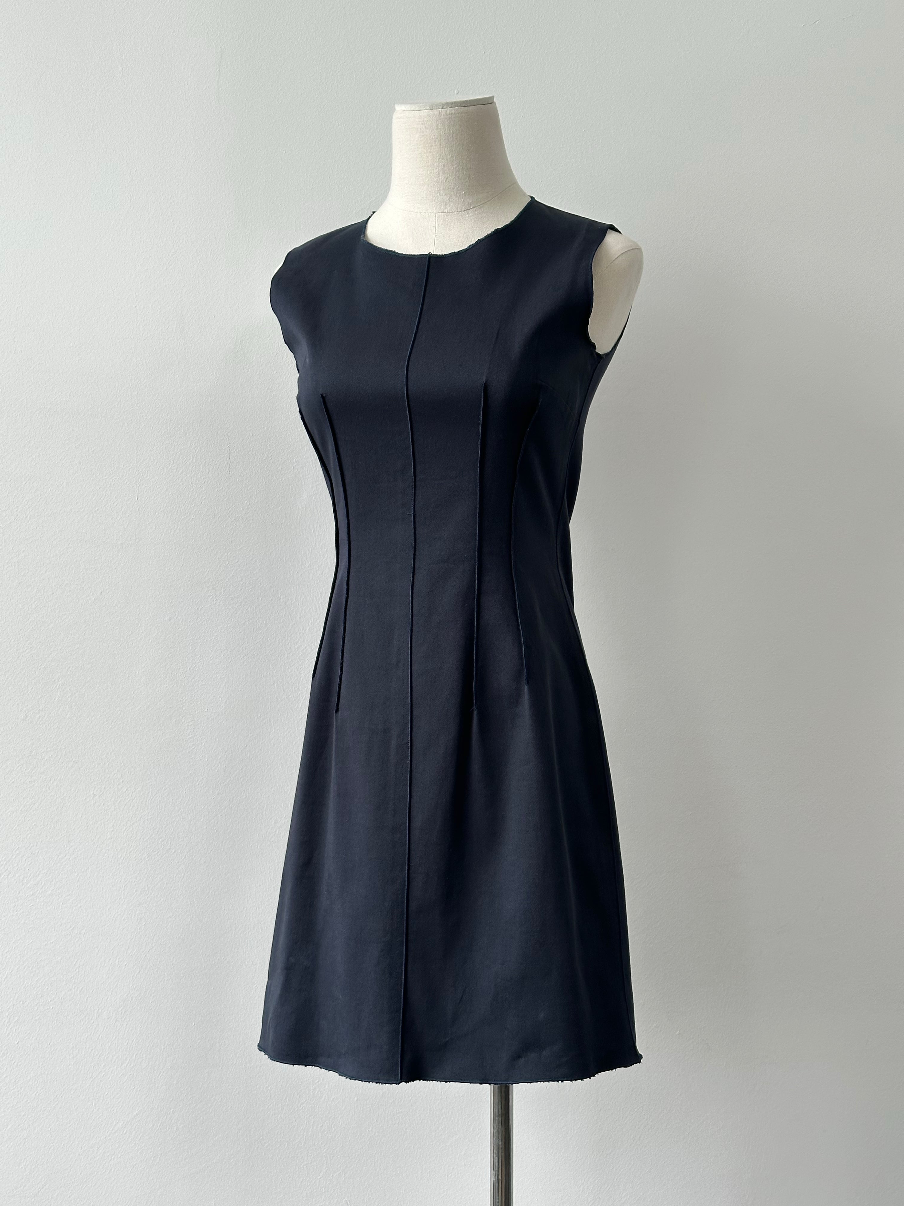 Dolce & Gabbana 2000s cotton fitted mini dress in white, size S, showcasing a sleek, tailored silhouette on a mannequin.