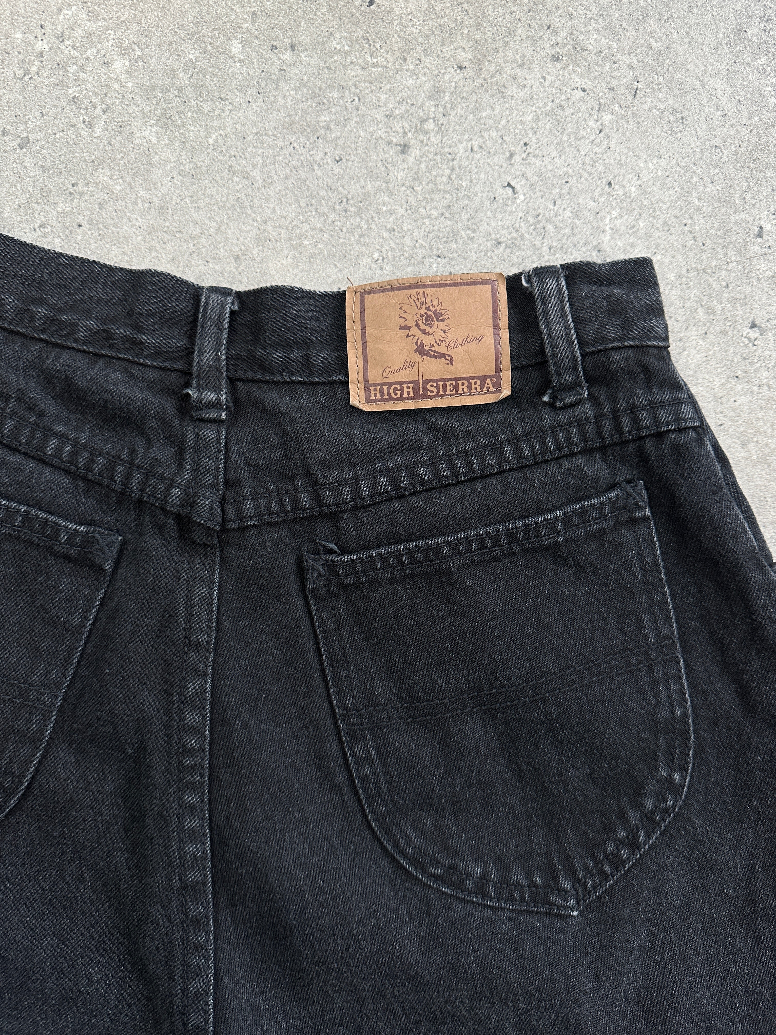 Vintage high waisted denim shorts for women, size W25, with distressed detailing and classic five-pocket design.