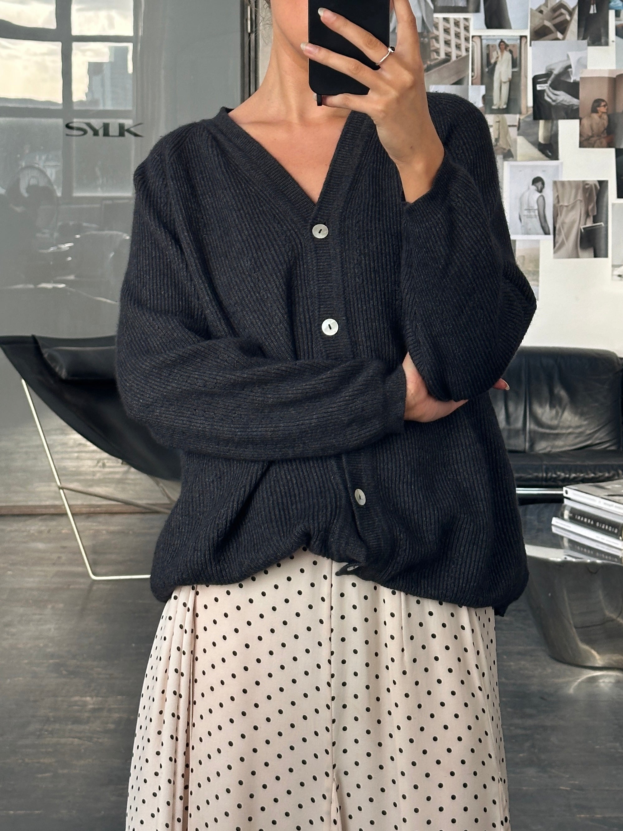 Versace Versus 1990s wool cardigan in M/L, featuring classic design and textured knit, displayed on a neutral background.