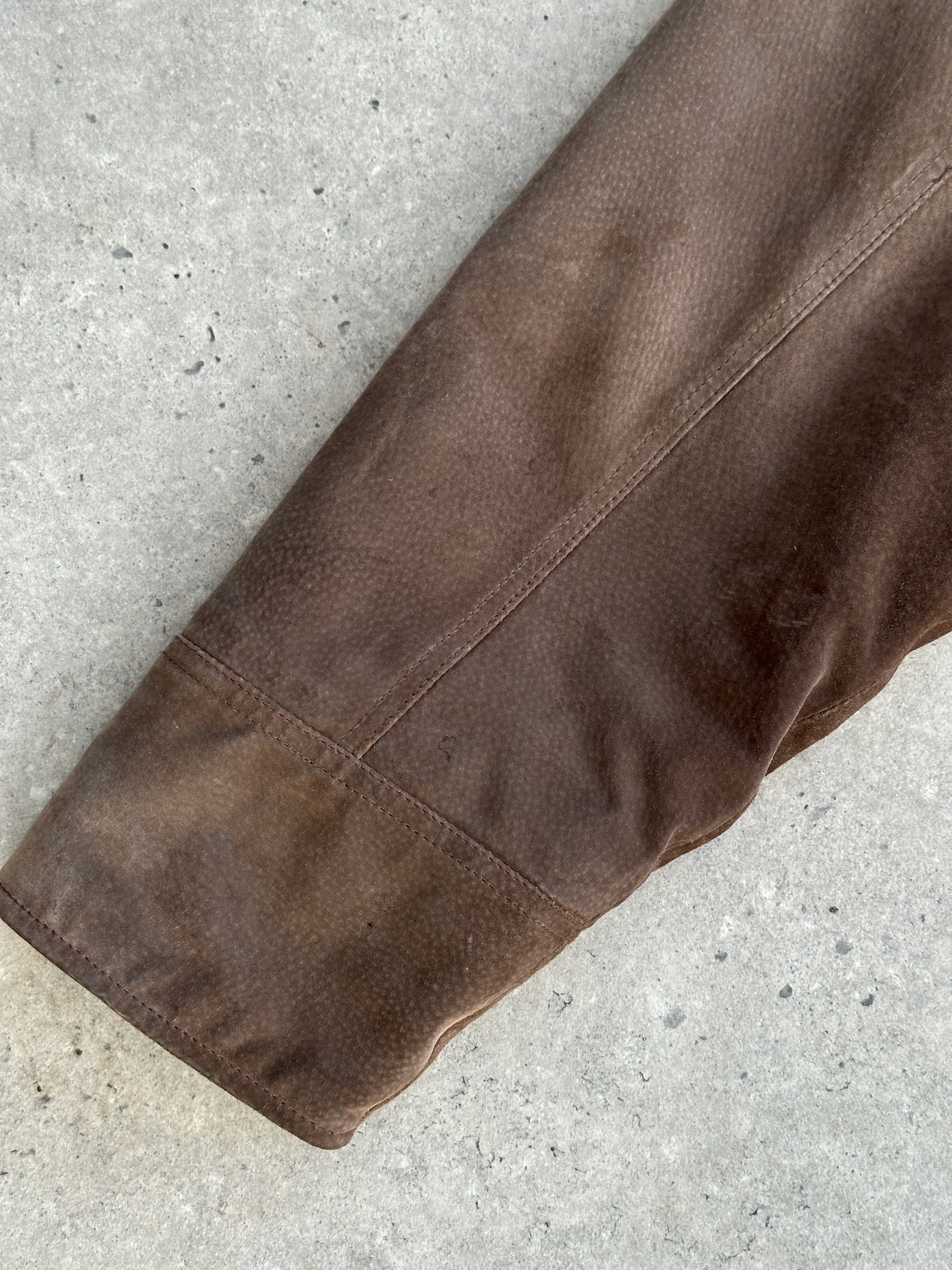 Vintage leather suede jacket in XL/XXL size, featuring a classic design and natural texture, displayed on a hanger.