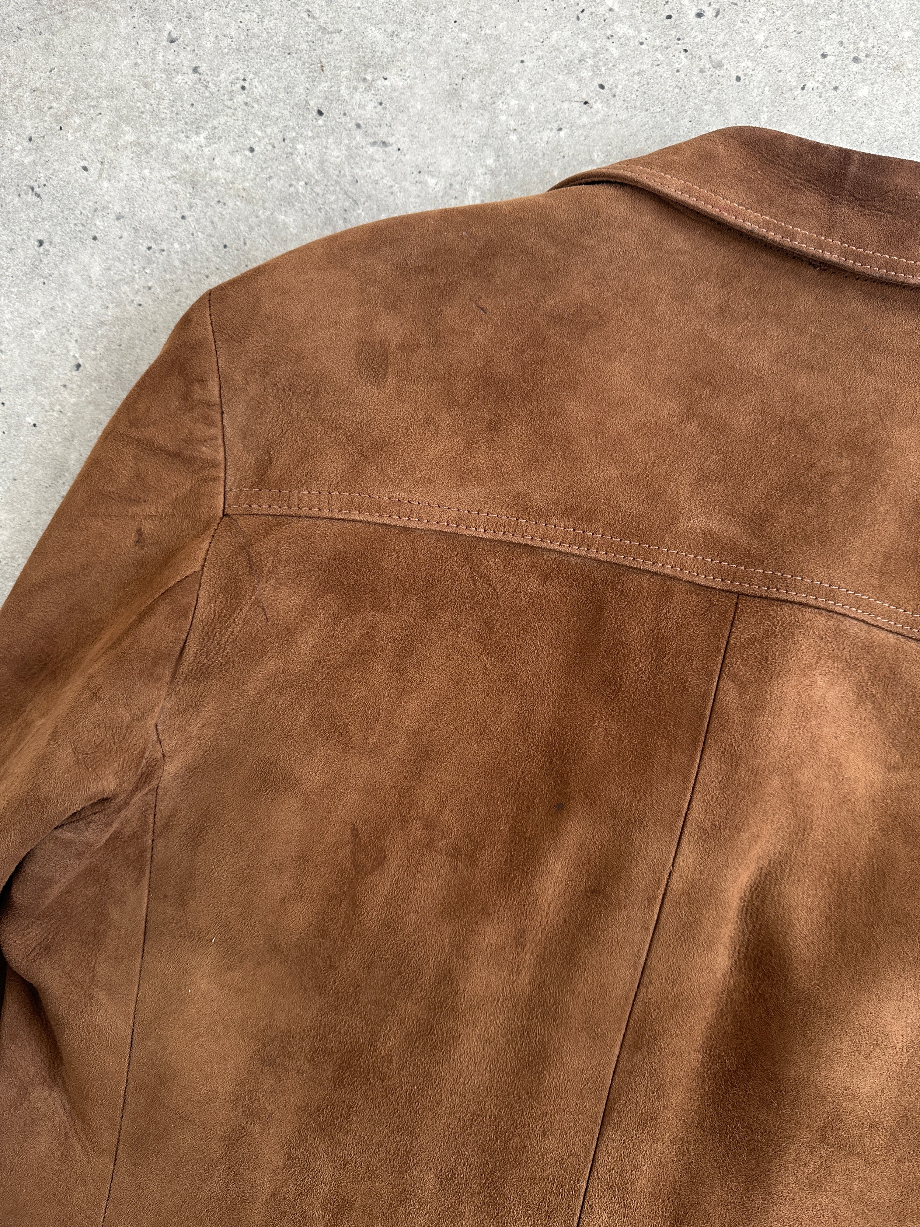 Vintage British 70s suede leather trucker jacket in size large, classic retro style with rugged detailing.