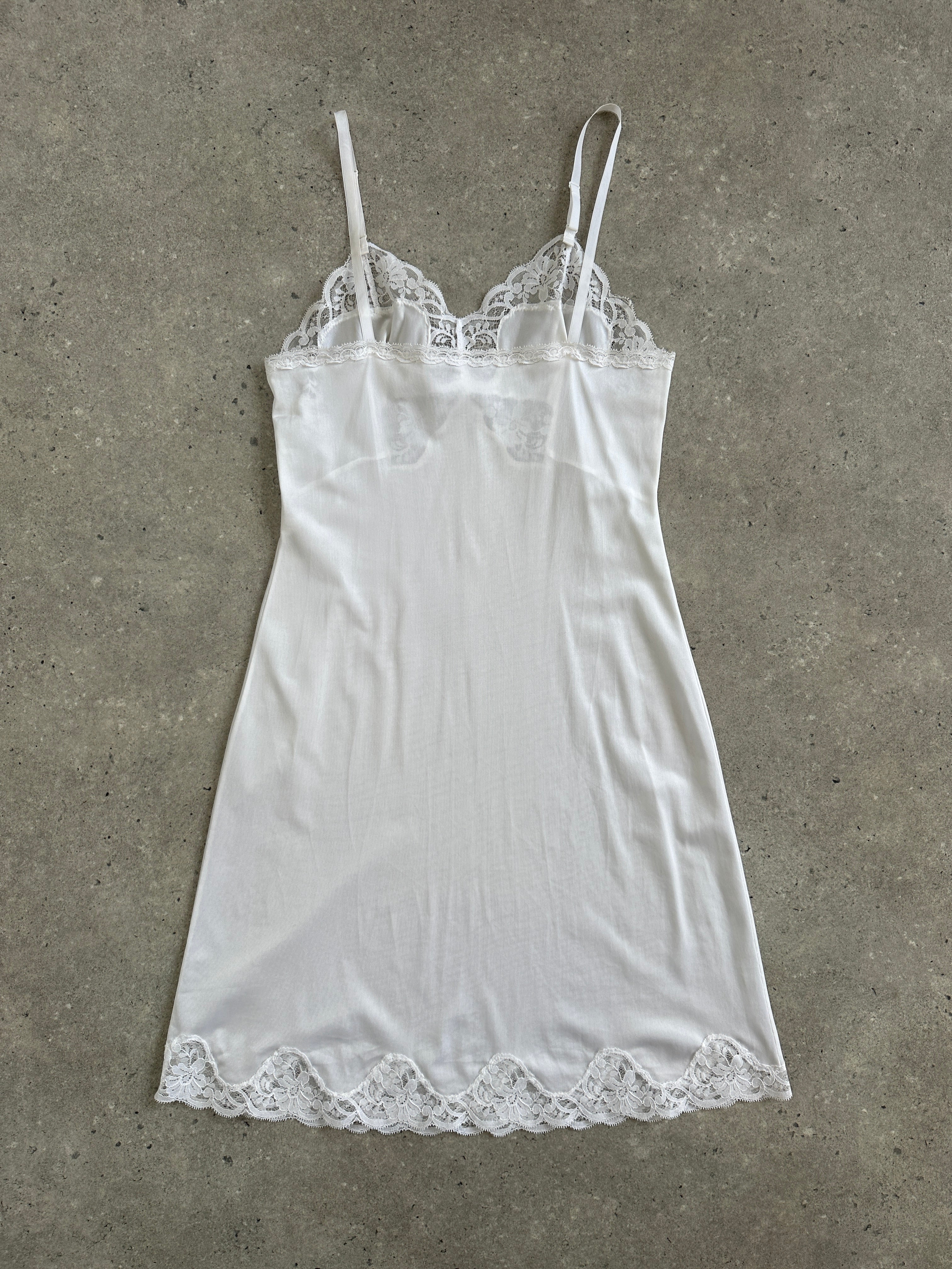 Vintage 1990s lace sheer mini slip dress, XS, featuring delicate lace fabric and a vintage-inspired design.