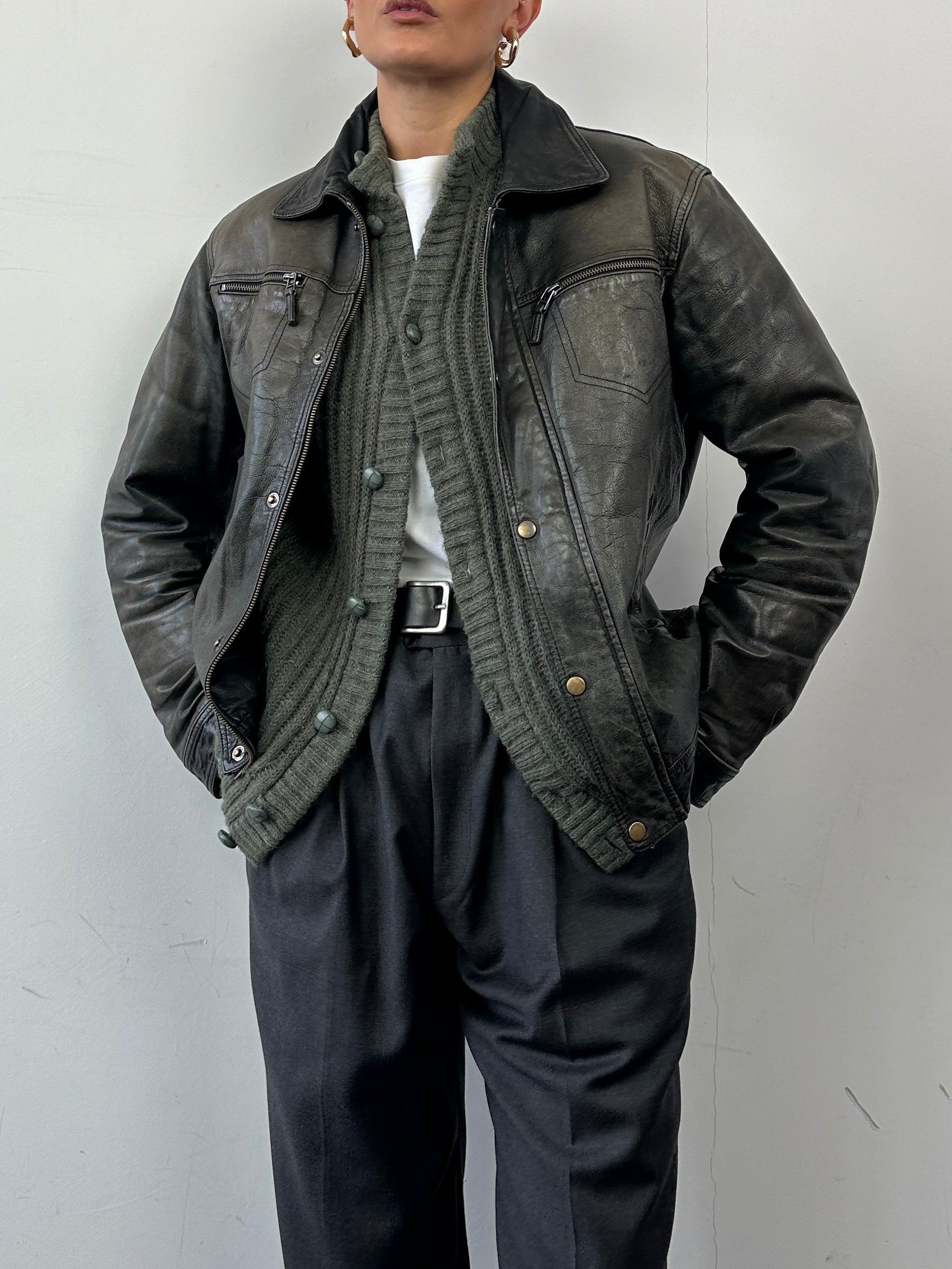 Conbipel distressed leather jacket in size M with rugged, worn-in look, featuring classic collar and zip closure.