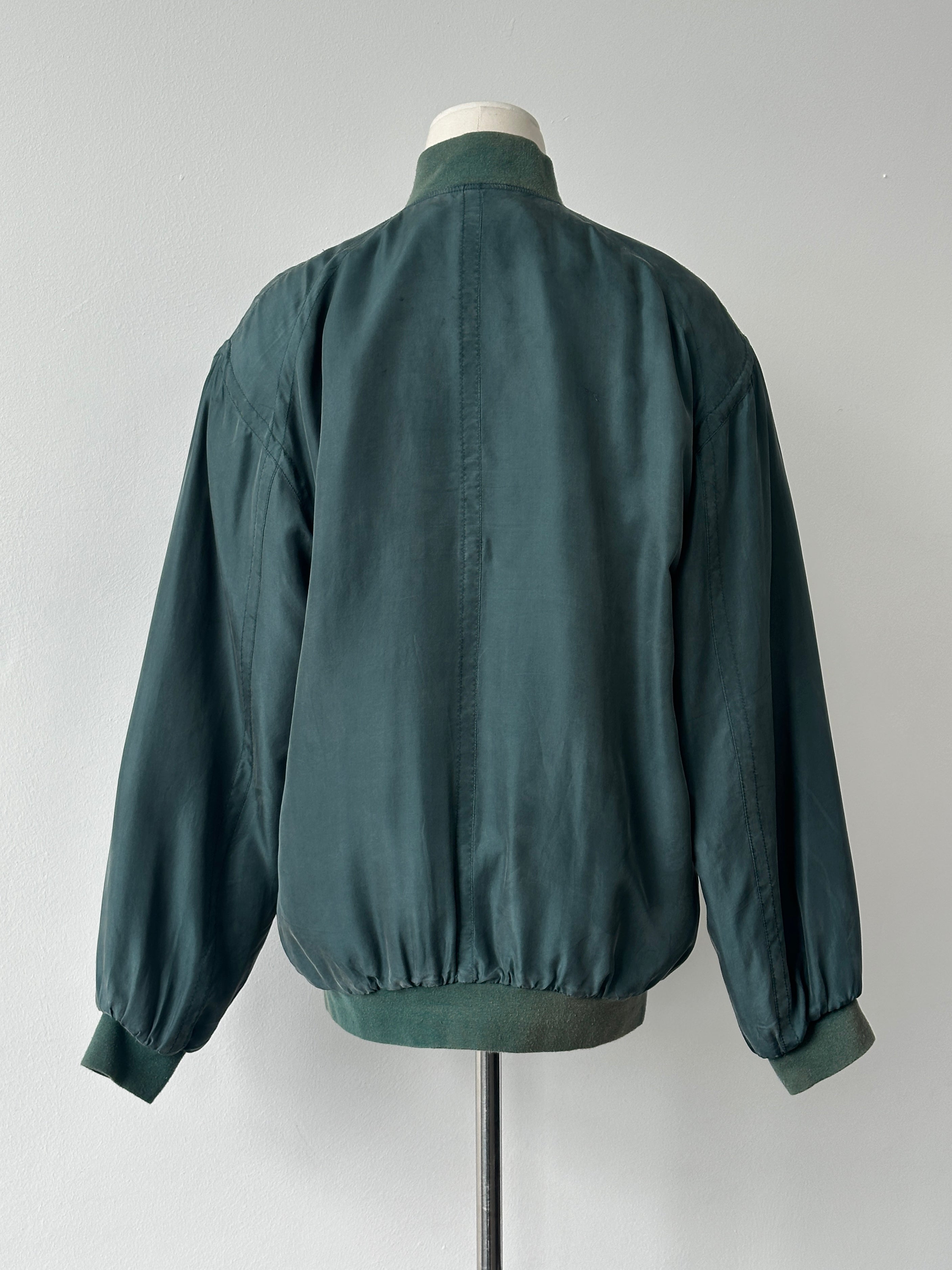 Vintage 1990s pure silk bomber jacket in size M, featuring a sleek design and classic style.
