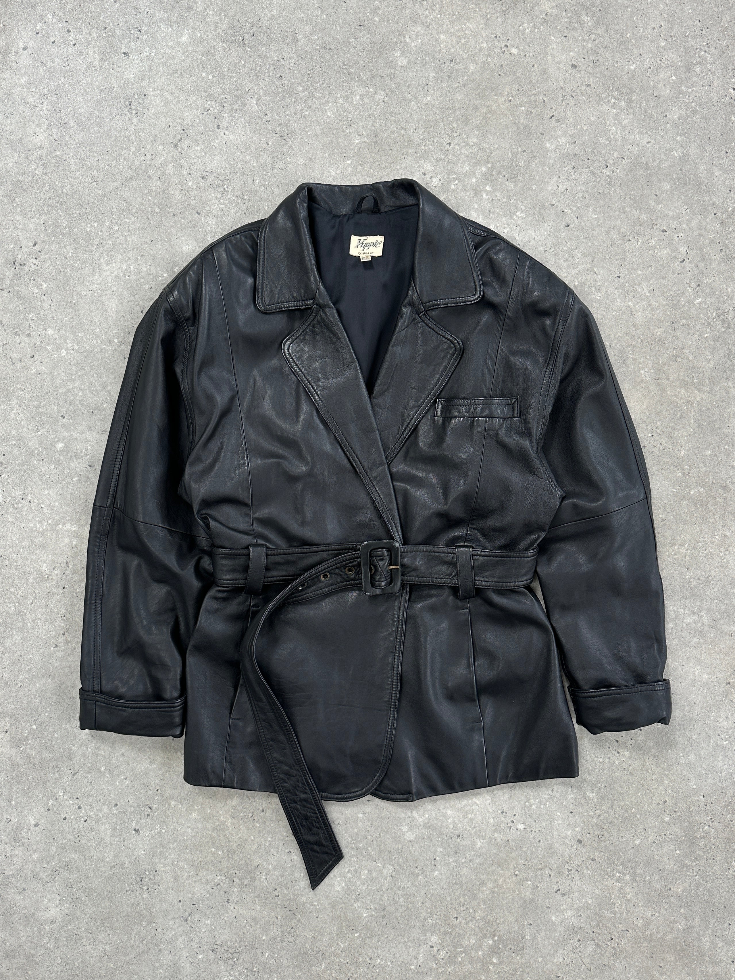 Vintage leather belted jacket from the 90s, size large, featuring classic design and authentic leather material.