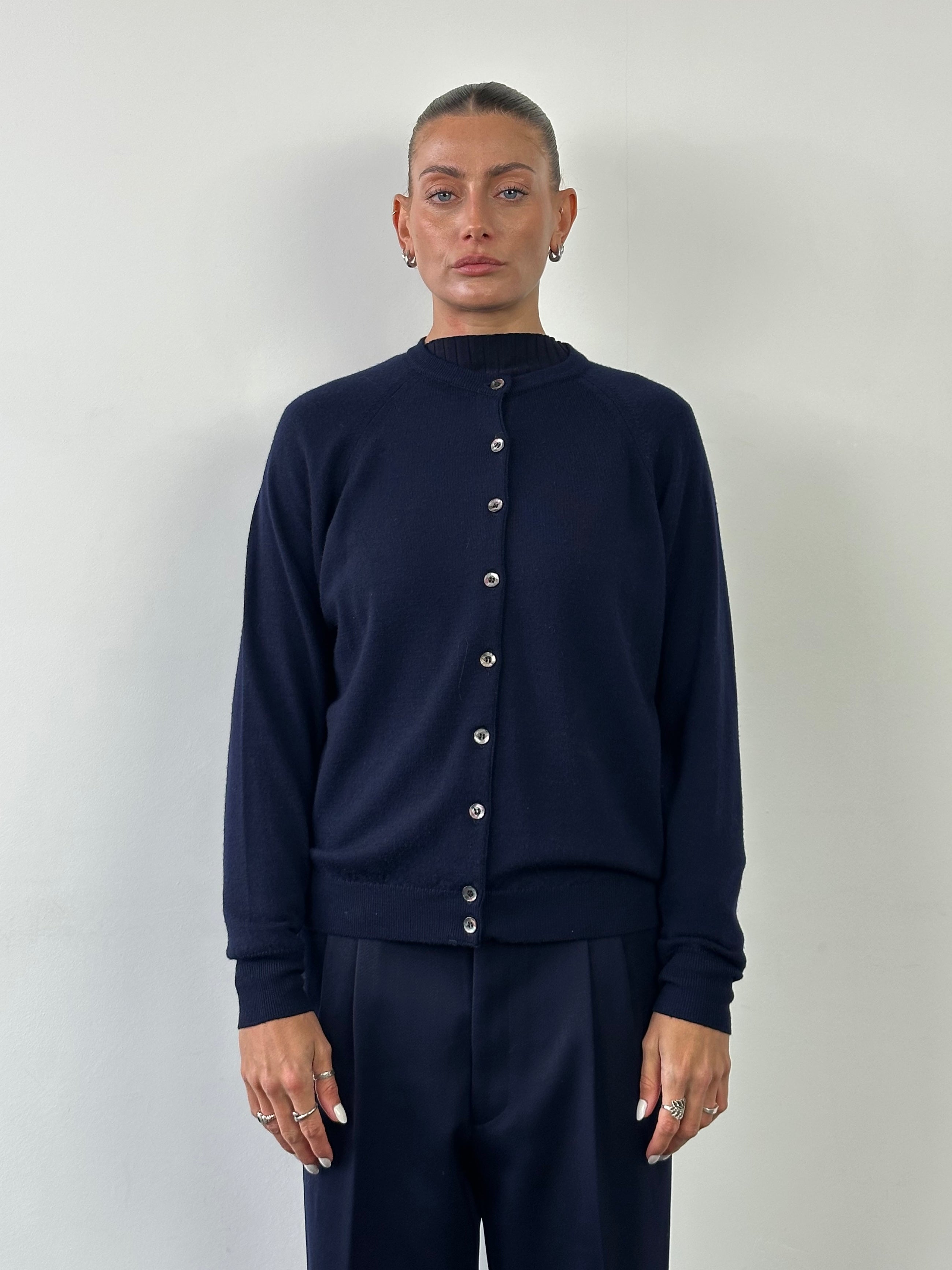 Vintage 1990s Scottish pure Merino wool round collar cardigan in size M, featuring a classic design and cozy knit texture.