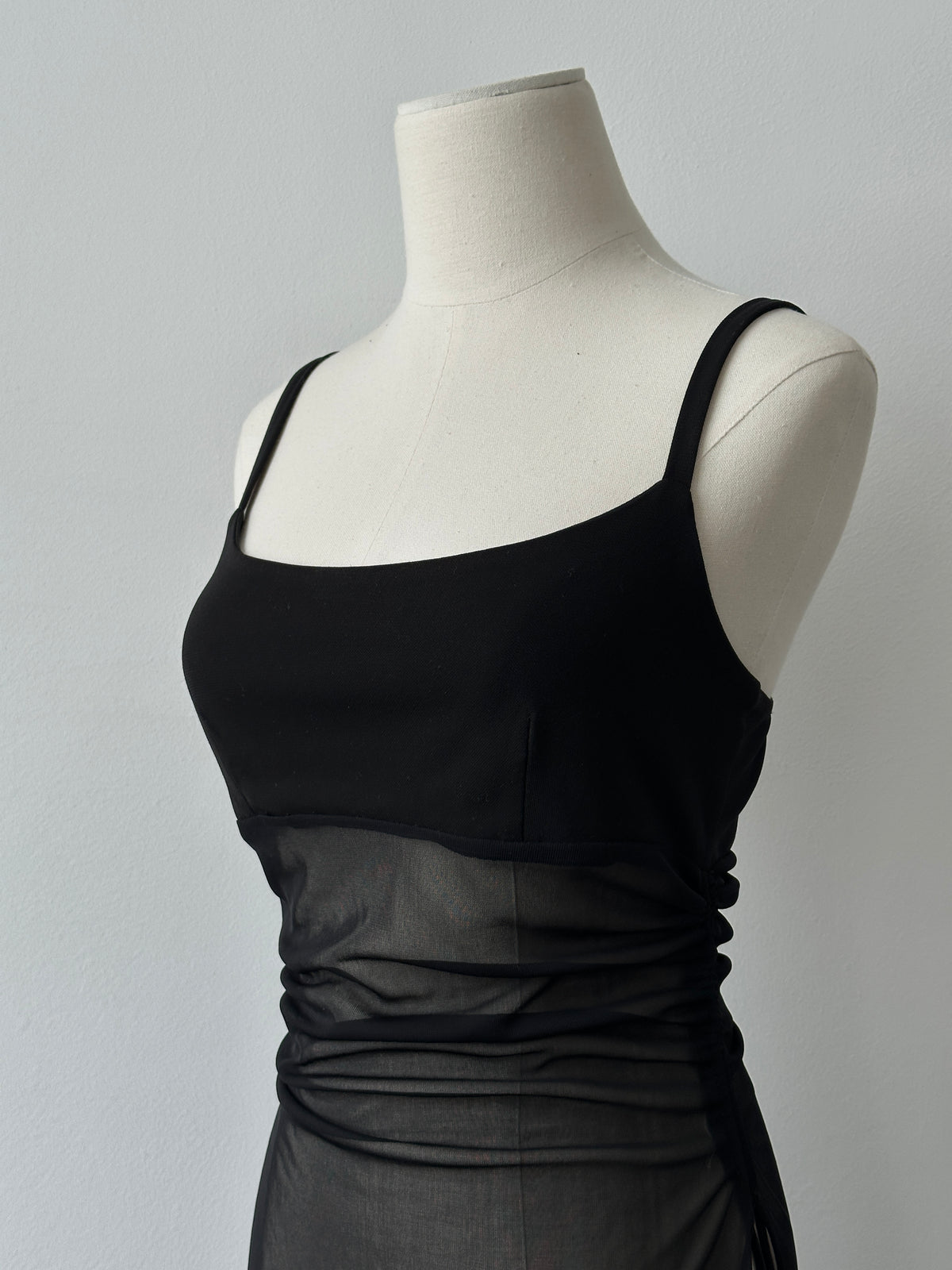 French vintage 1990s sheer sleeveless top, size small, featuring delicate fabric and classic design from the 1990s era.