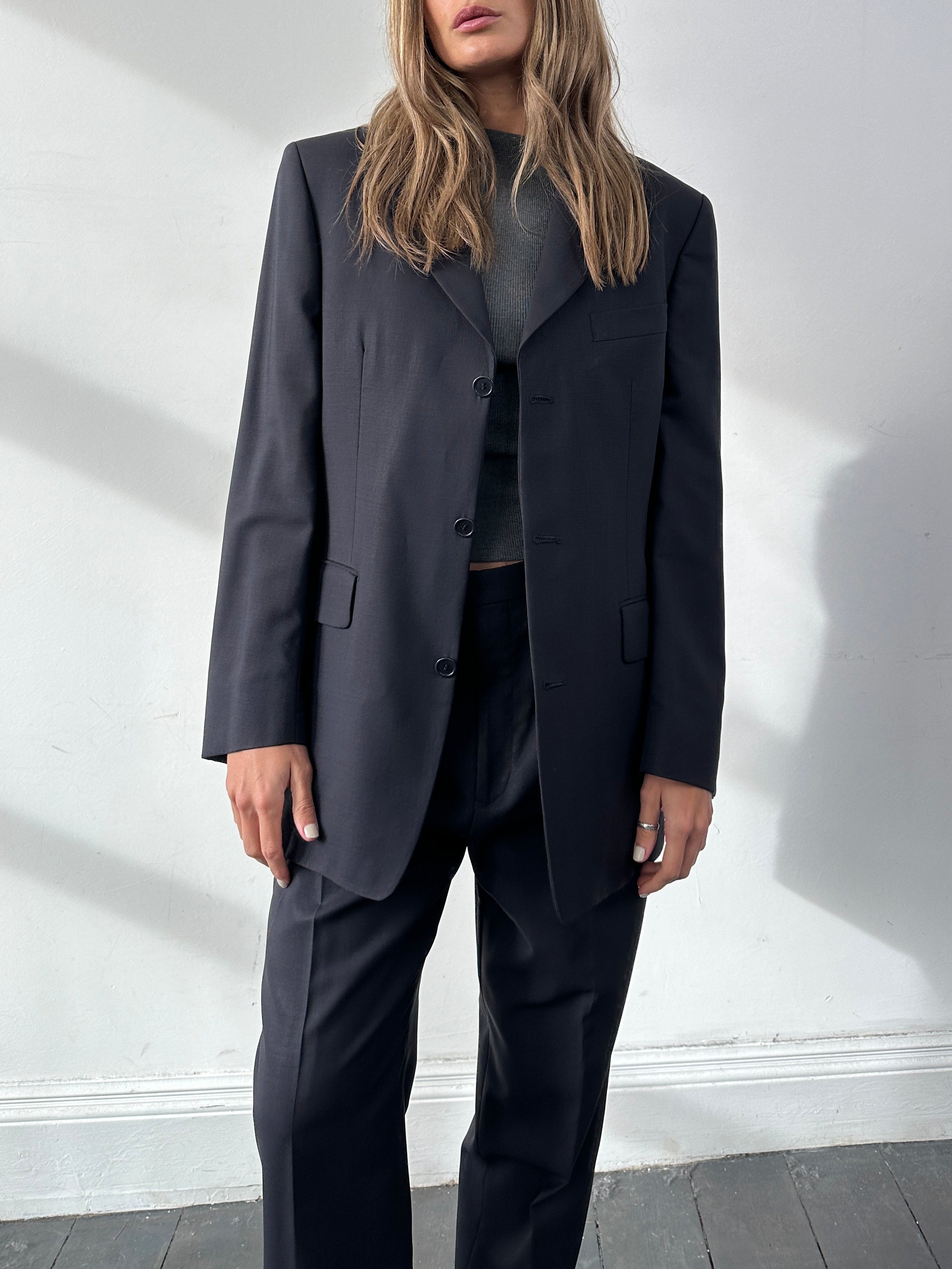 Yves Saint Laurent Pour Homme wool single-breasted suit in size 38R/W30, tailored fit, dark fabric, front buttons, and classic lapel.