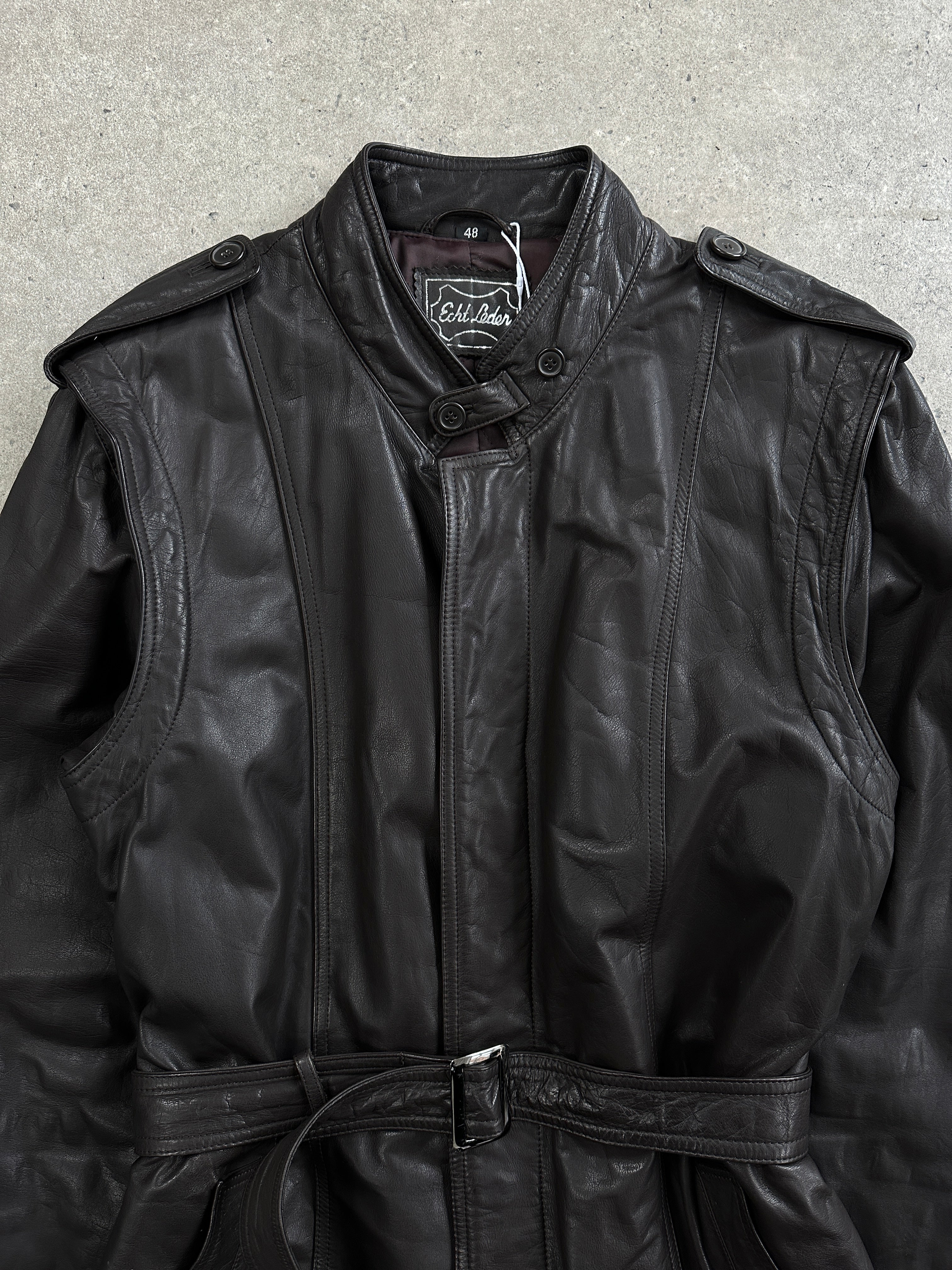 Vintage Italian 1990s belted leather trench coat, stylish jacket with classic design, in size L/XL, featuring a timeless leather finish.