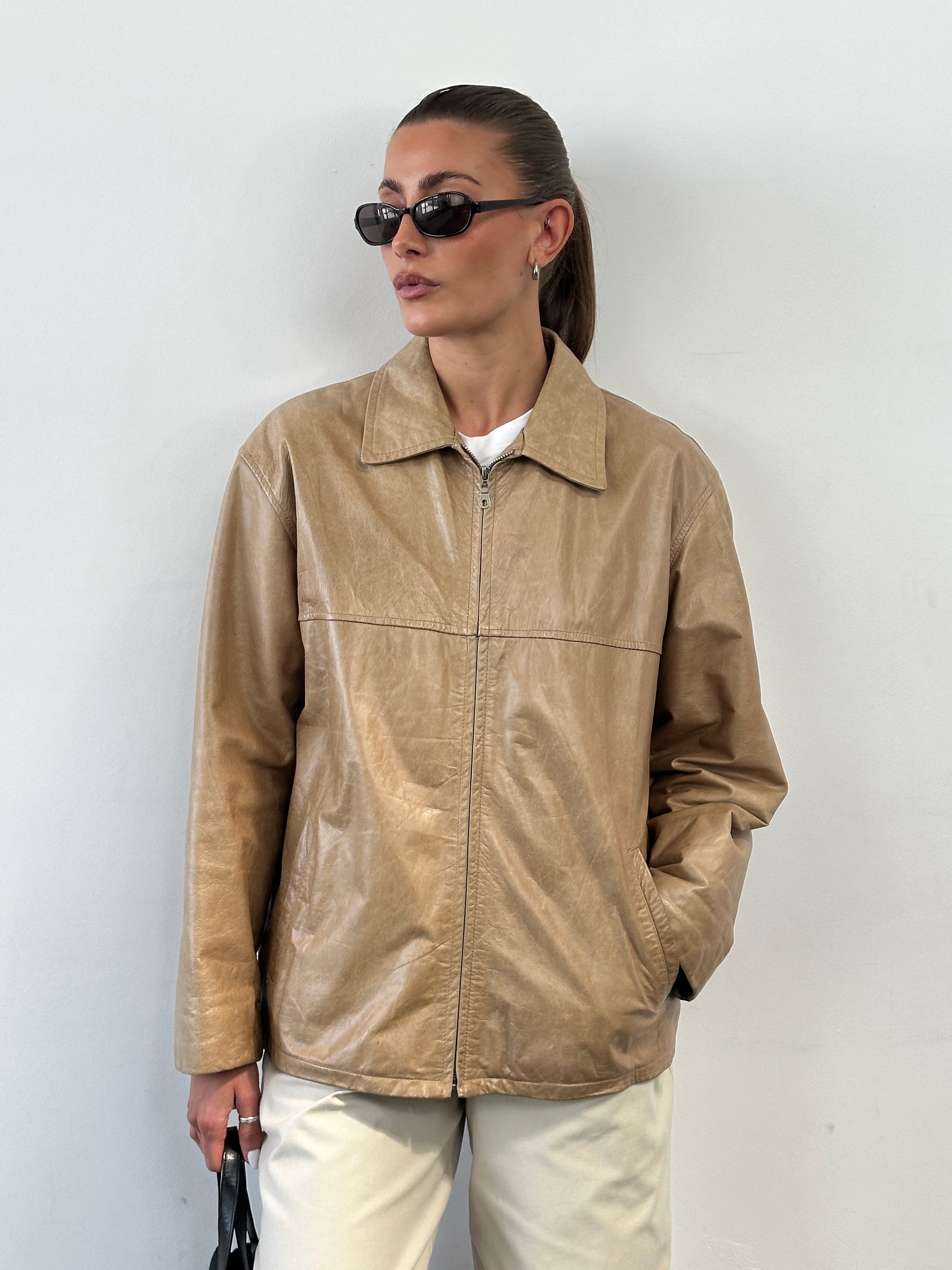 Vintage Italian vintage minimal leather jacket in size L, showcasing classic design and smooth leather material.