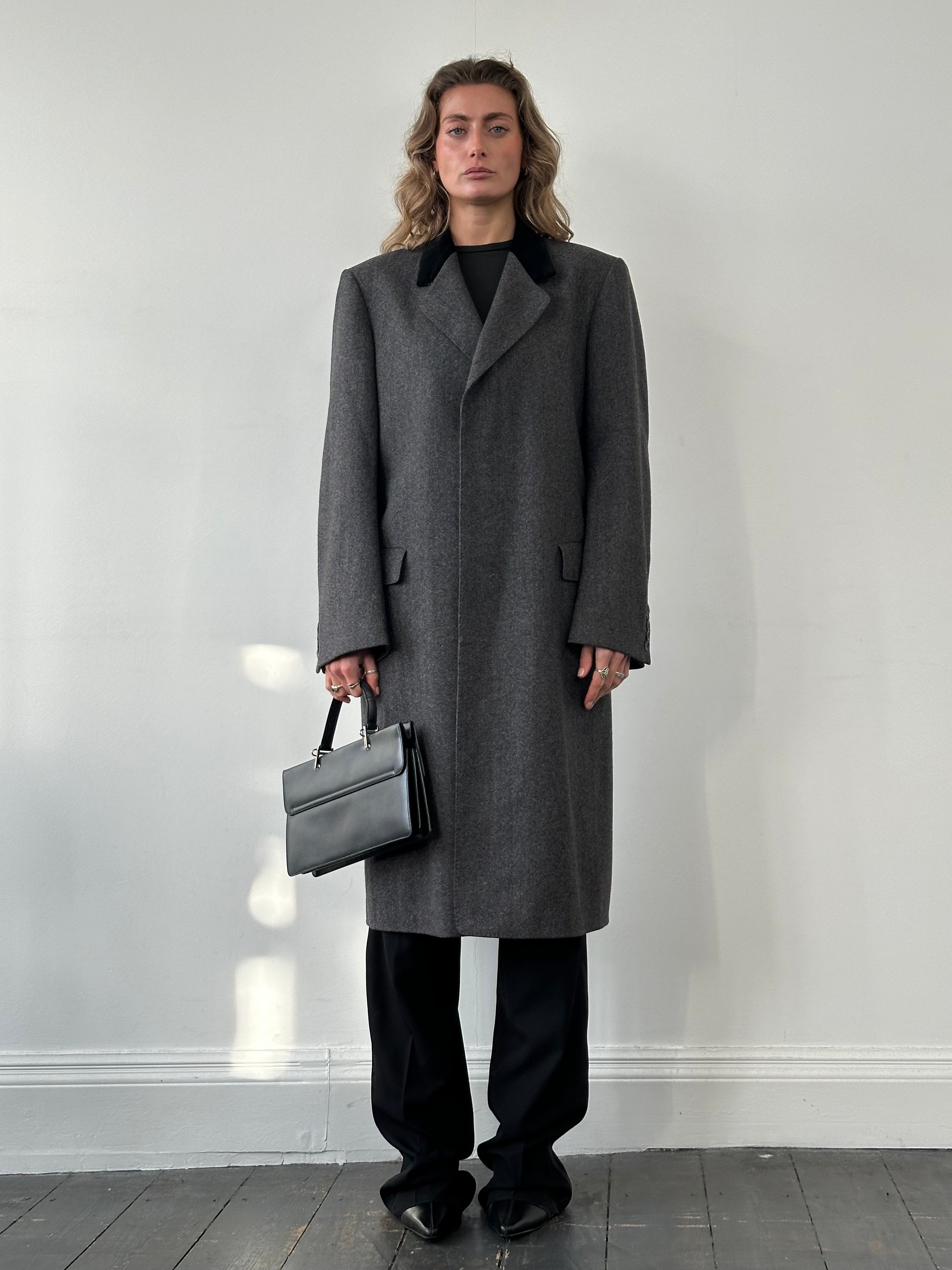 Christian Dior pure wool single-breasted coat in size L/XL, showcasing classic tailored design and elegant style.