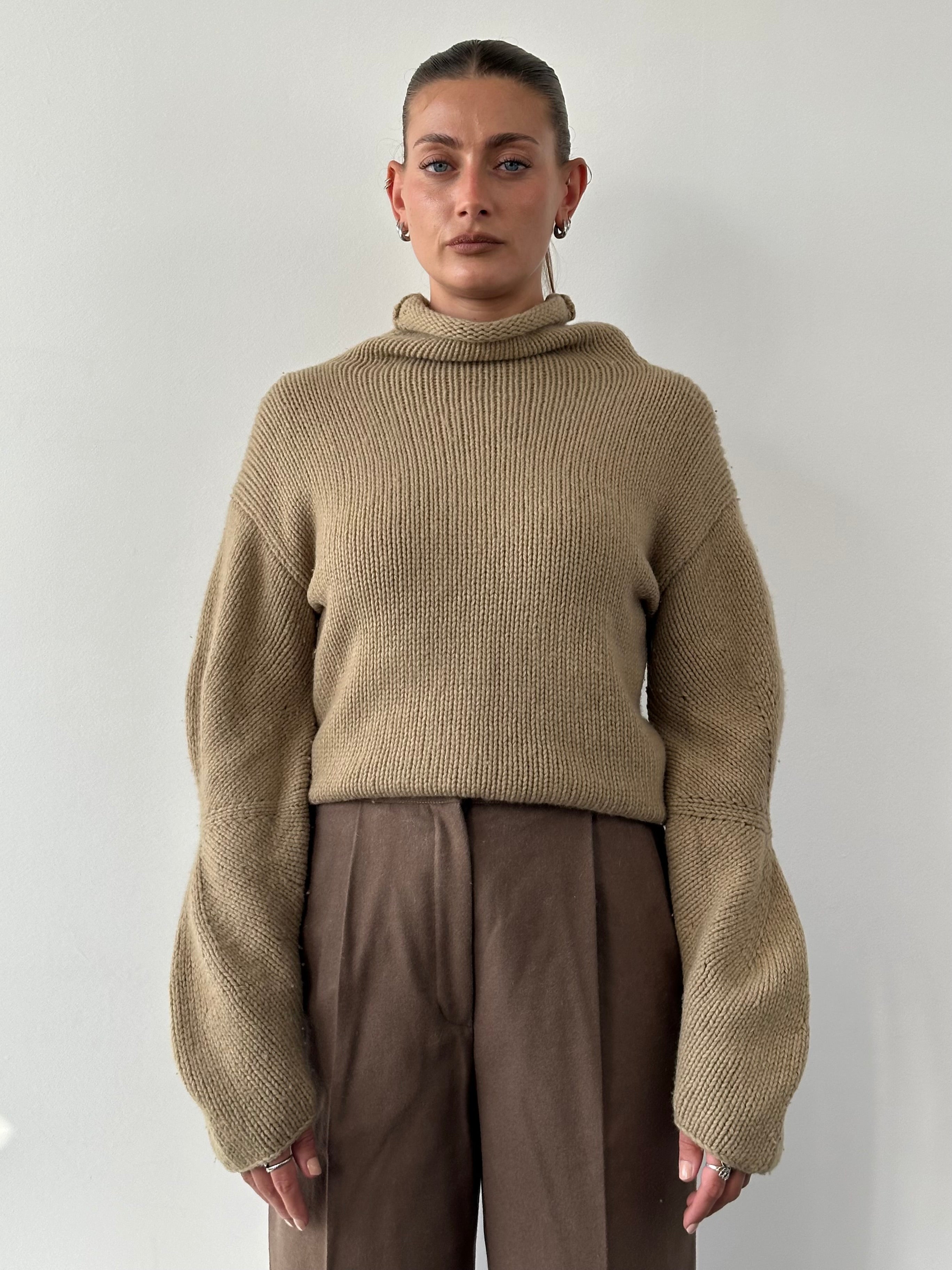 Armani Jeans wool roll neck jumper in size M, featuring a cozy knit design and classic fit, ideal for stylish winter wear.