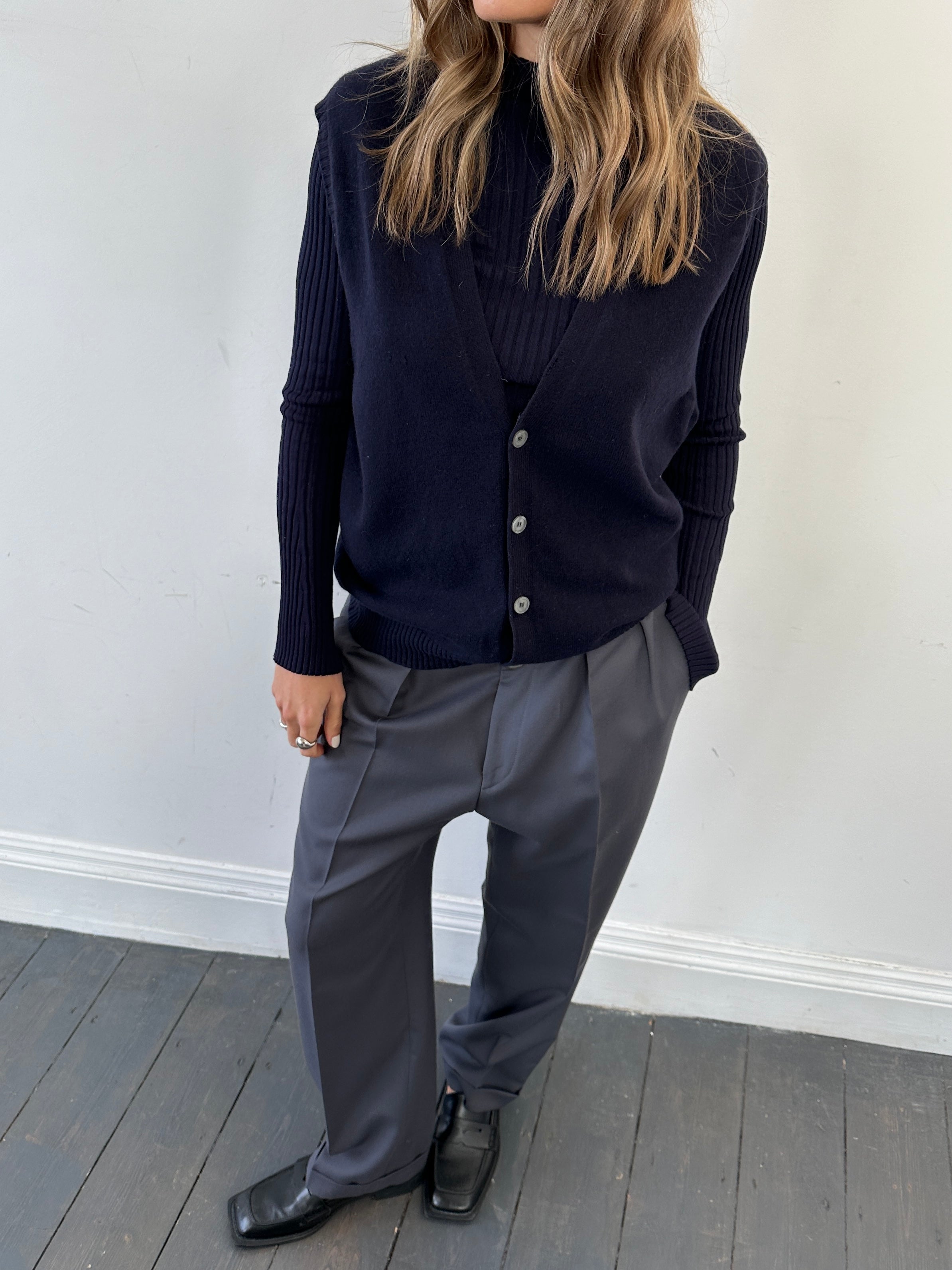 Vintage brand vintage cashmere sleeveless cardigan in size L, soft knit with open front and ribbed edges, displayed on a plain background.