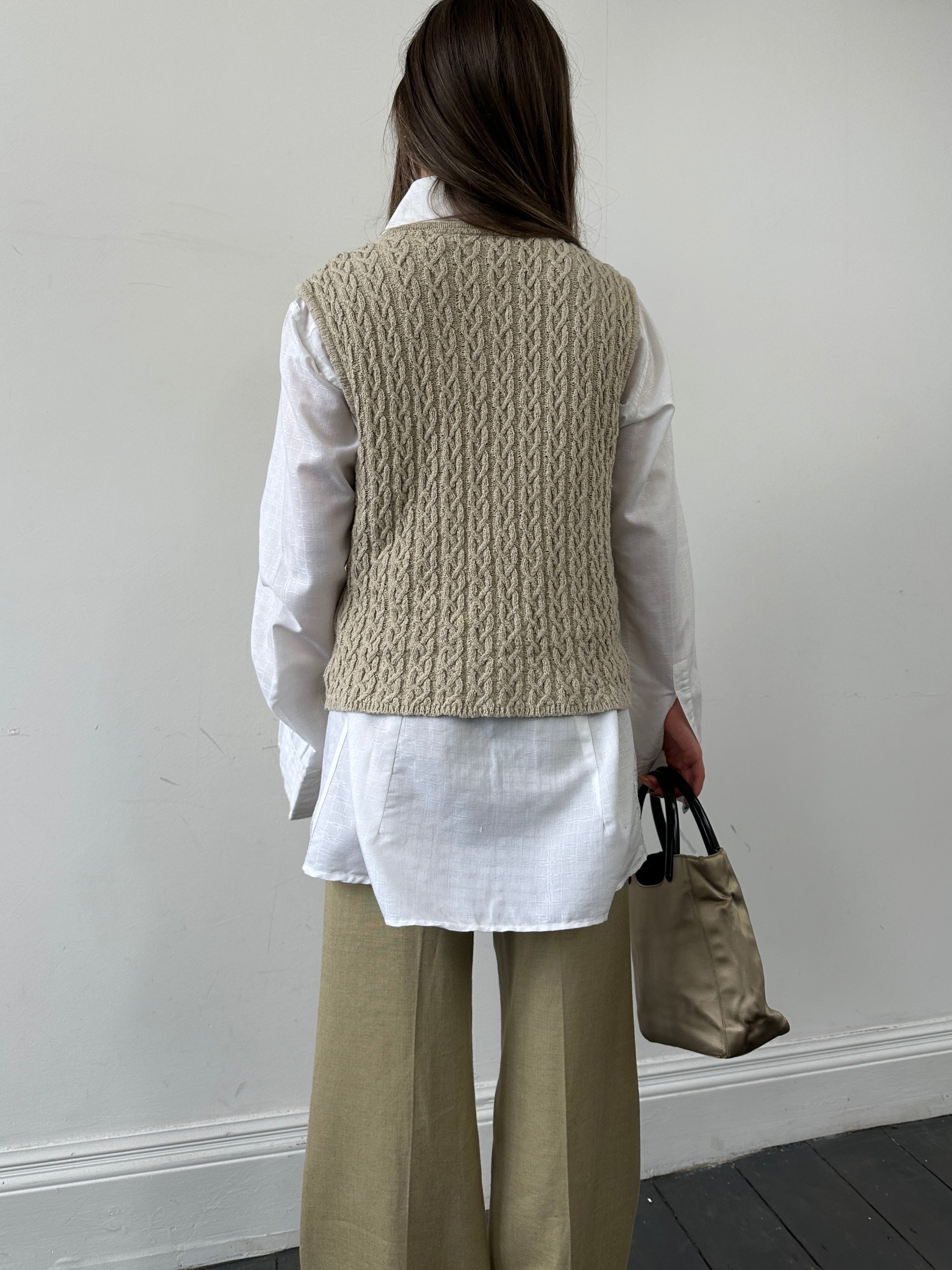 Vintage cotton Aran knit vest in size S/M, featuring textured knit pattern and classic design, perfect for layered casual style.